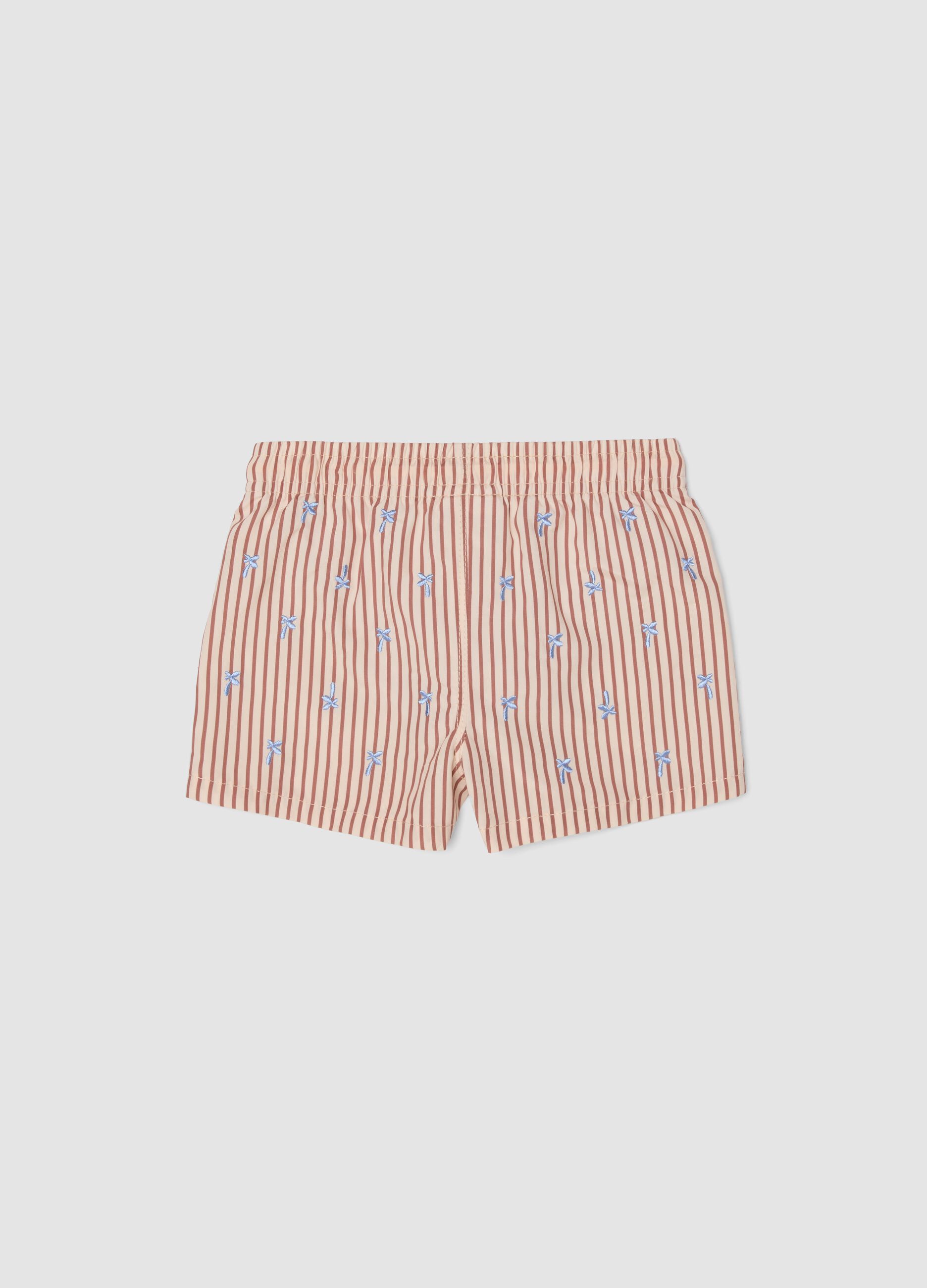 Rosafarbene Baby-Boxer-Badehose mit Streifen und Stickereien