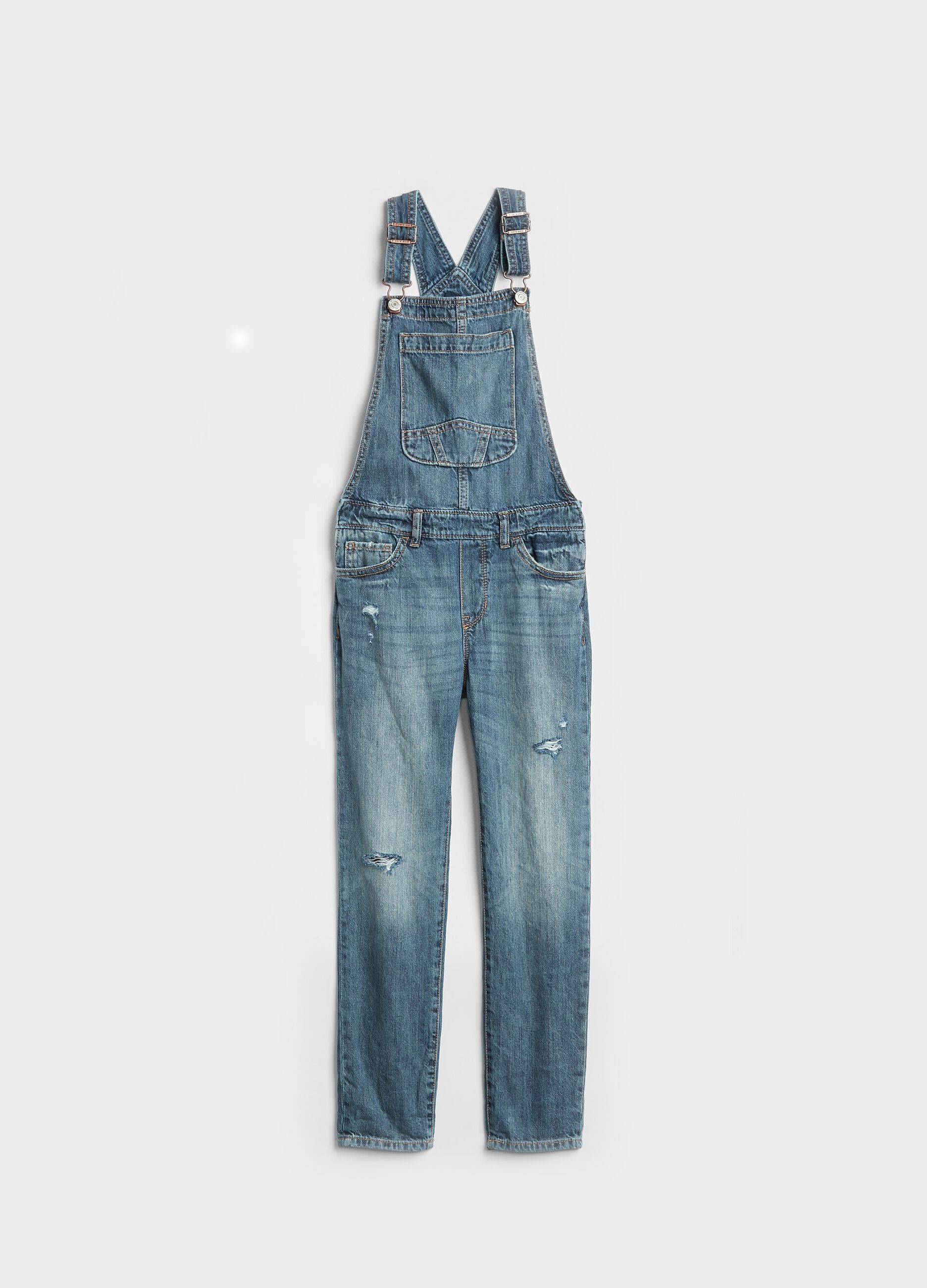 Denim dungarees with rips
