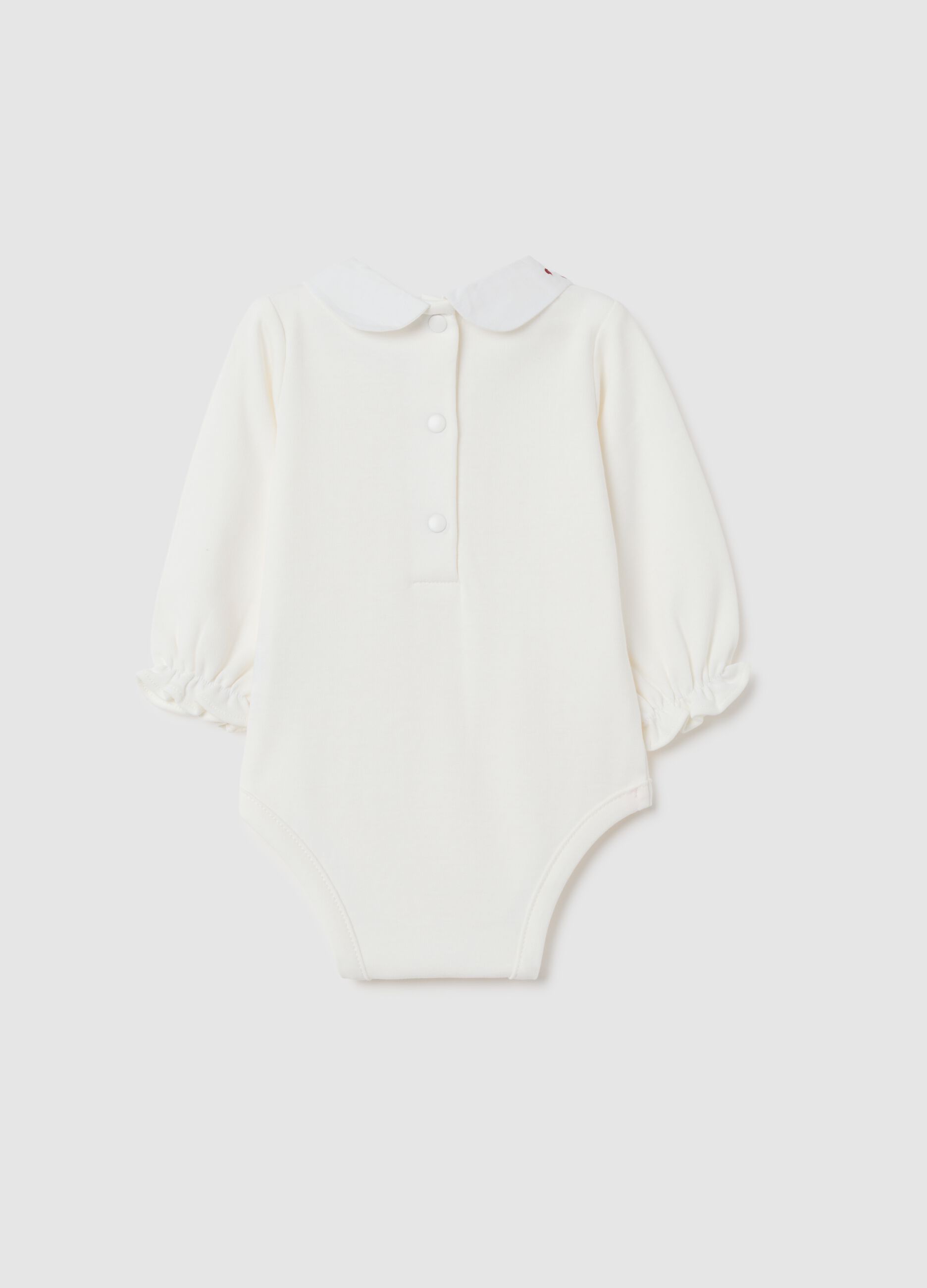 Newborn baby bodysuit in pure white cotton with ruffled collar