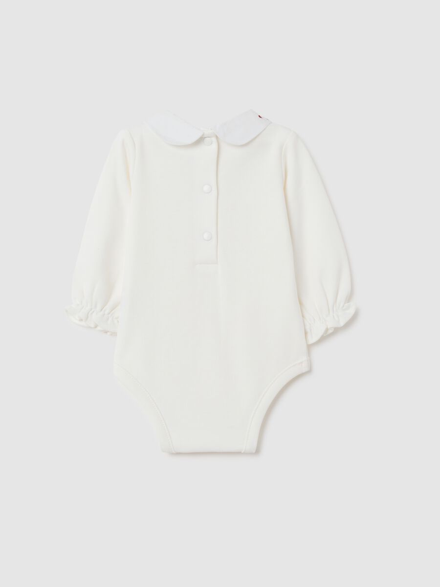 Newborn baby bodysuit in pure white cotton with ruffled collar_1