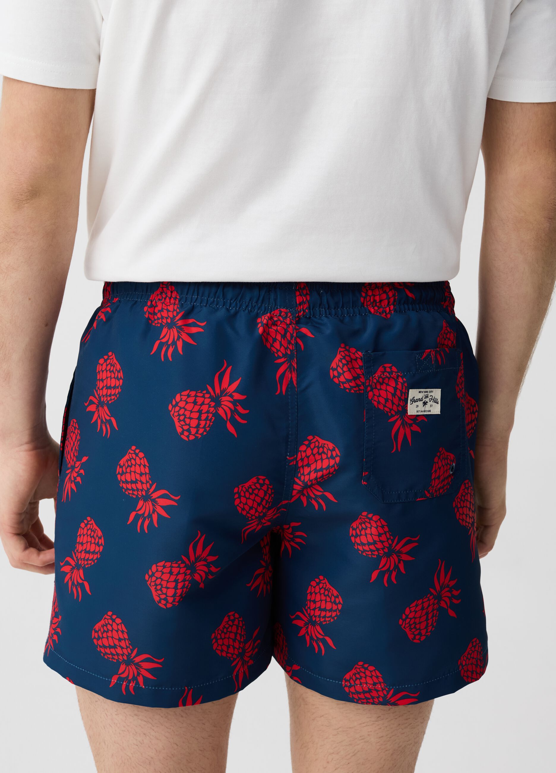 Swimming trunks with pineapples print
