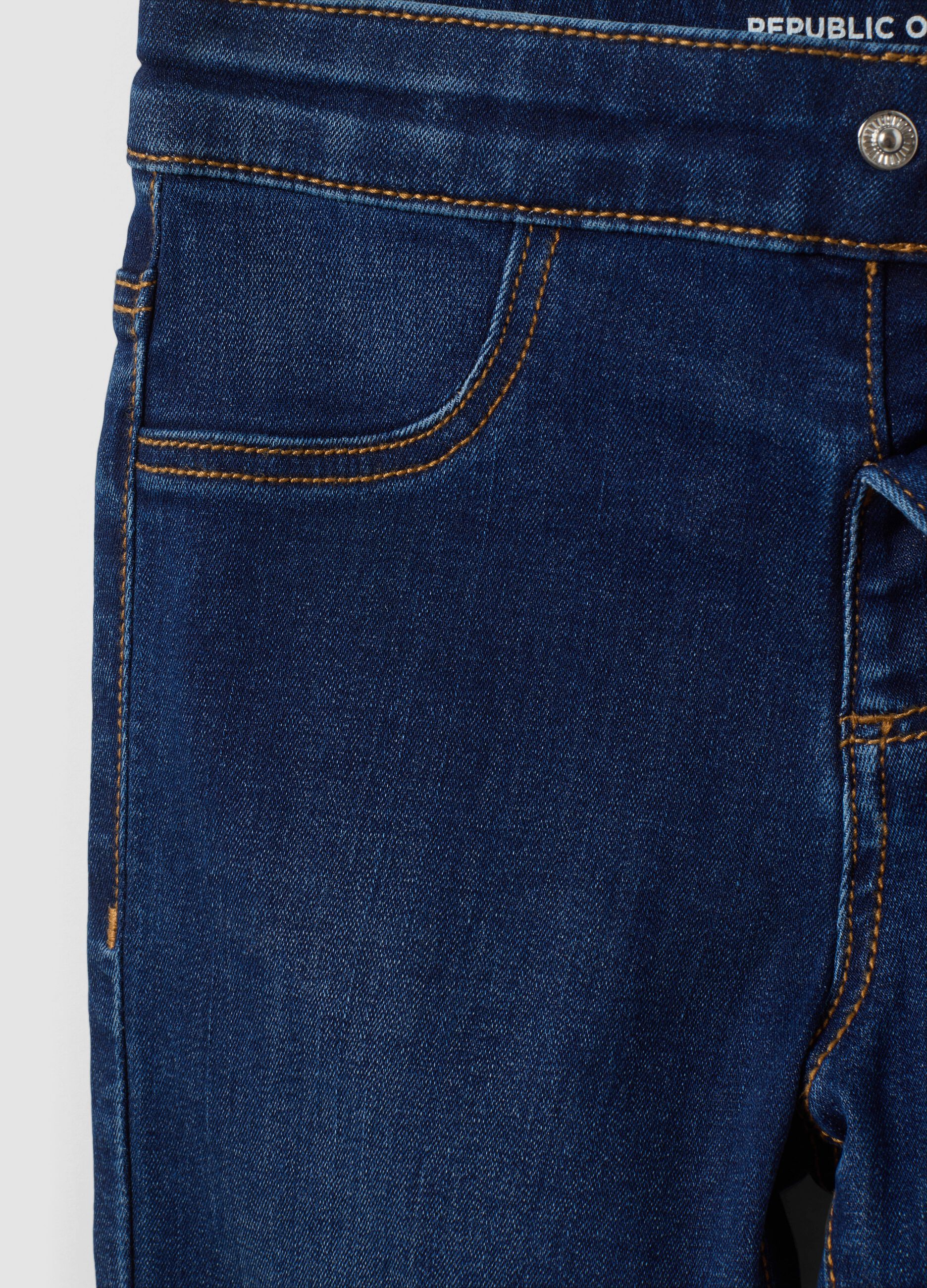 Jeans blu flare in cotone e viscosa elasticizzata per bambina
