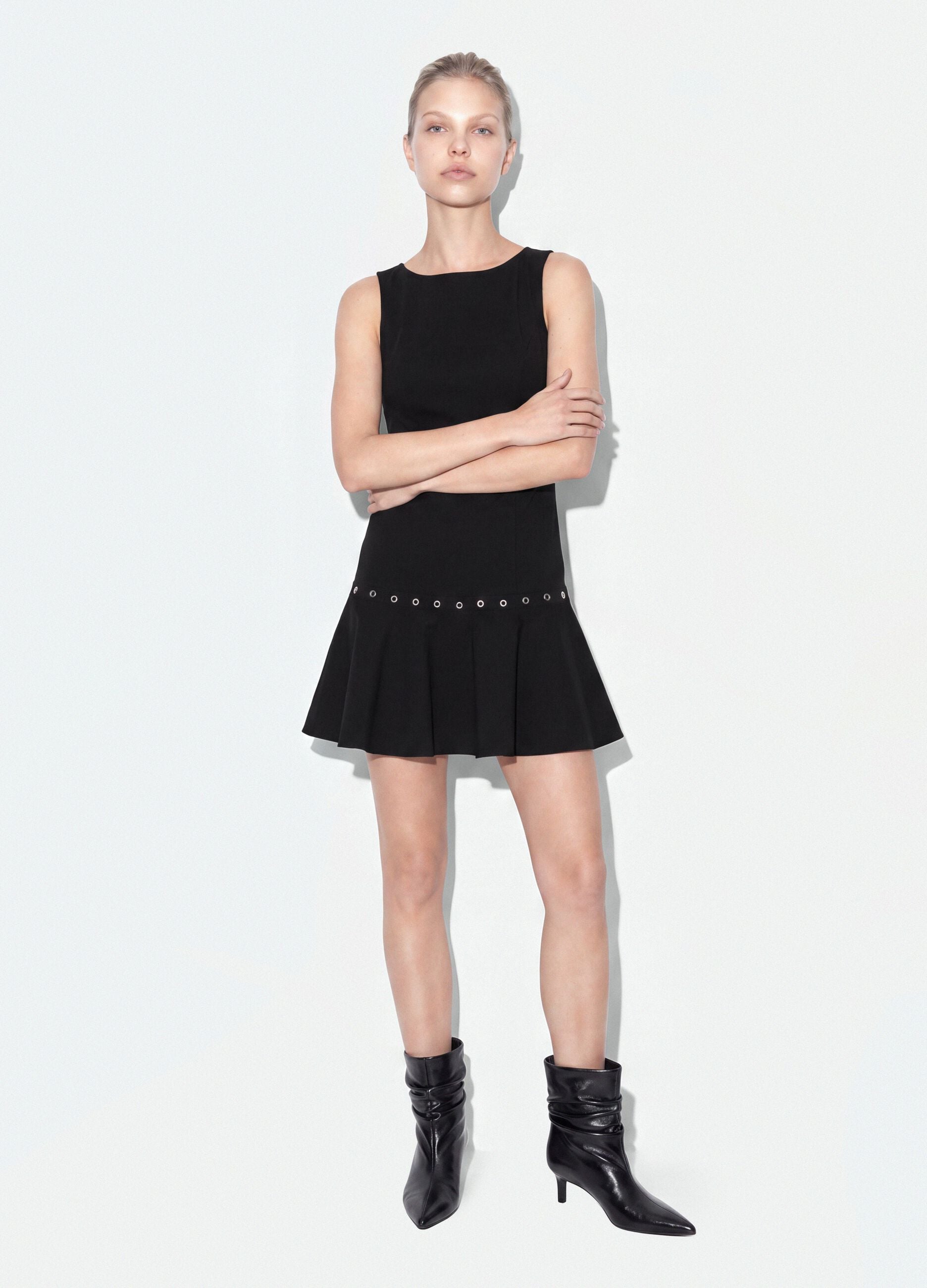 Black sleeveless stretch viscose dress with eyelets
