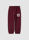 Pantaloni jogger rossi in puro cotone con stampa_0