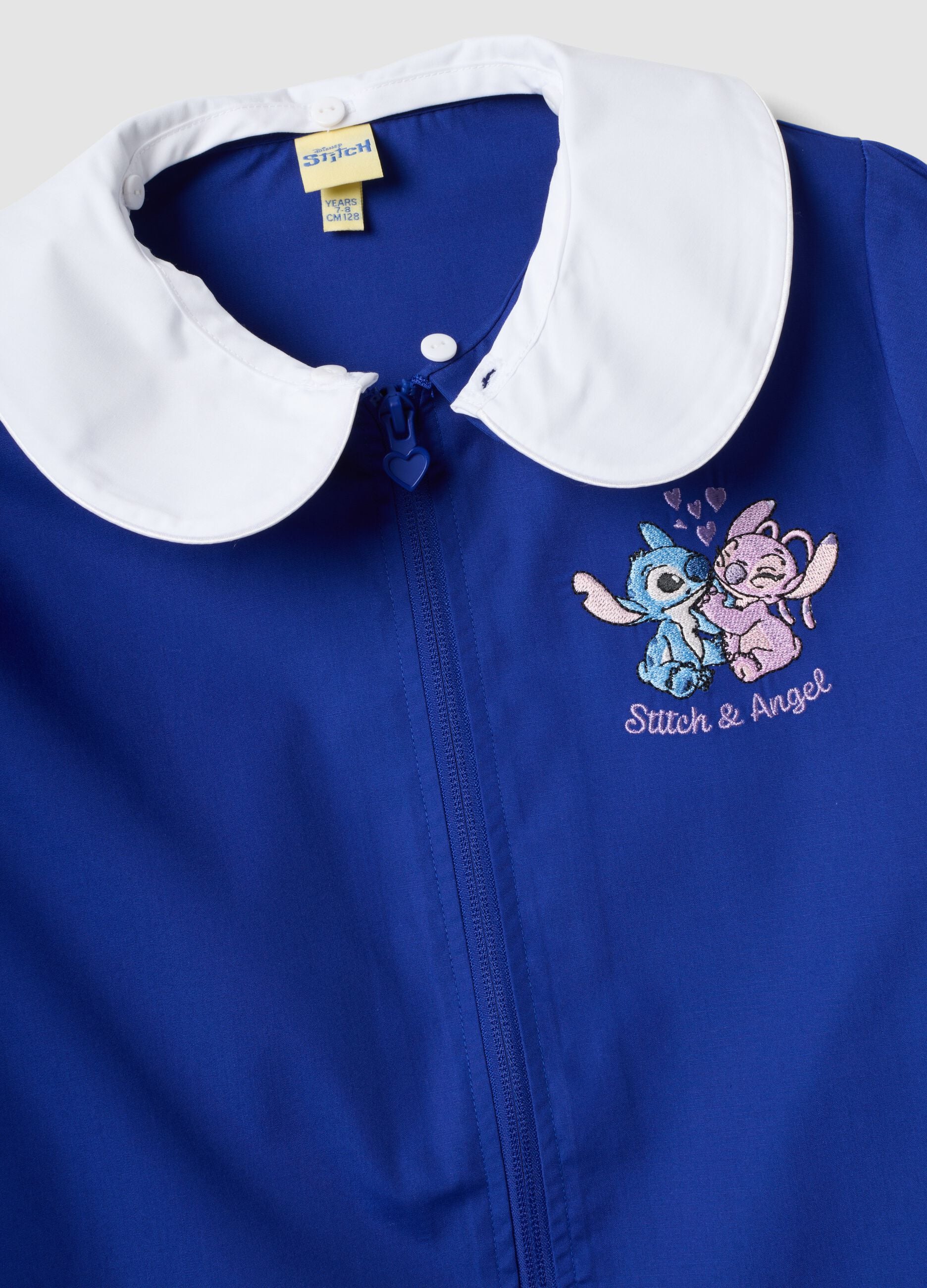 Babi escolar azul para ni&ntilde;a con cuello blanco y bordado de Stitch