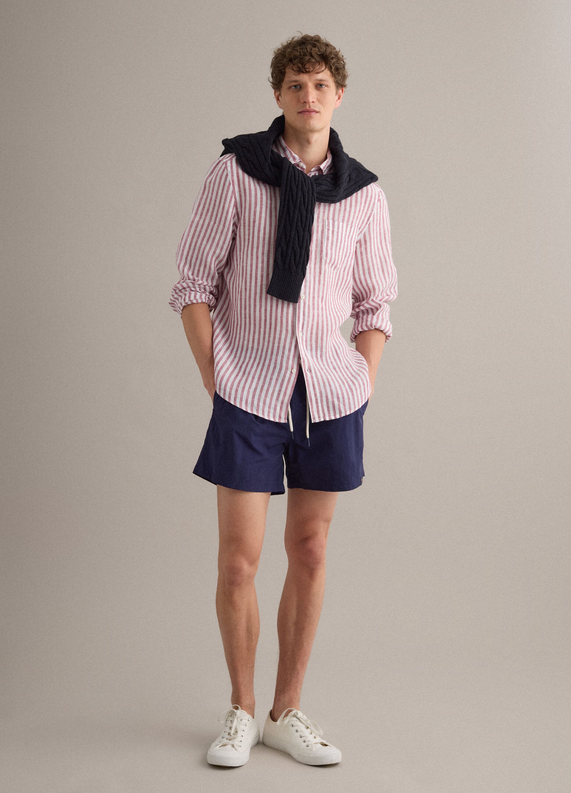Blue swim shorts with elasticated waistband and drawstring