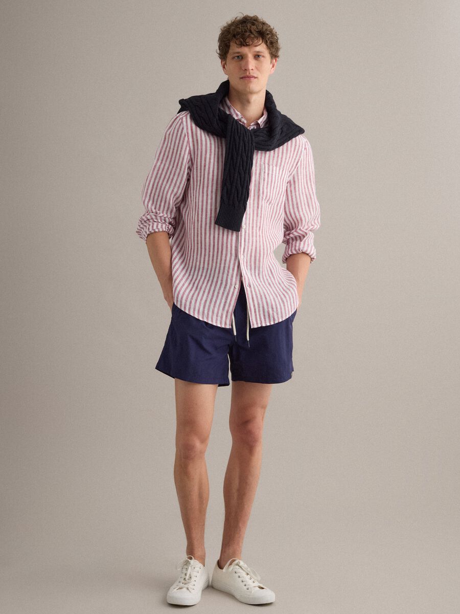 Blue swim shorts with elasticated waistband and drawstring_1