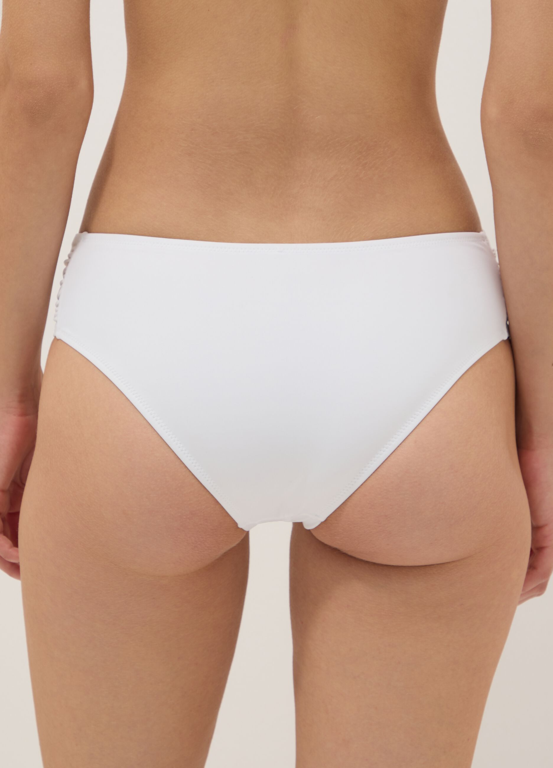 White stretch bikini bottoms with ruched details, regular fit