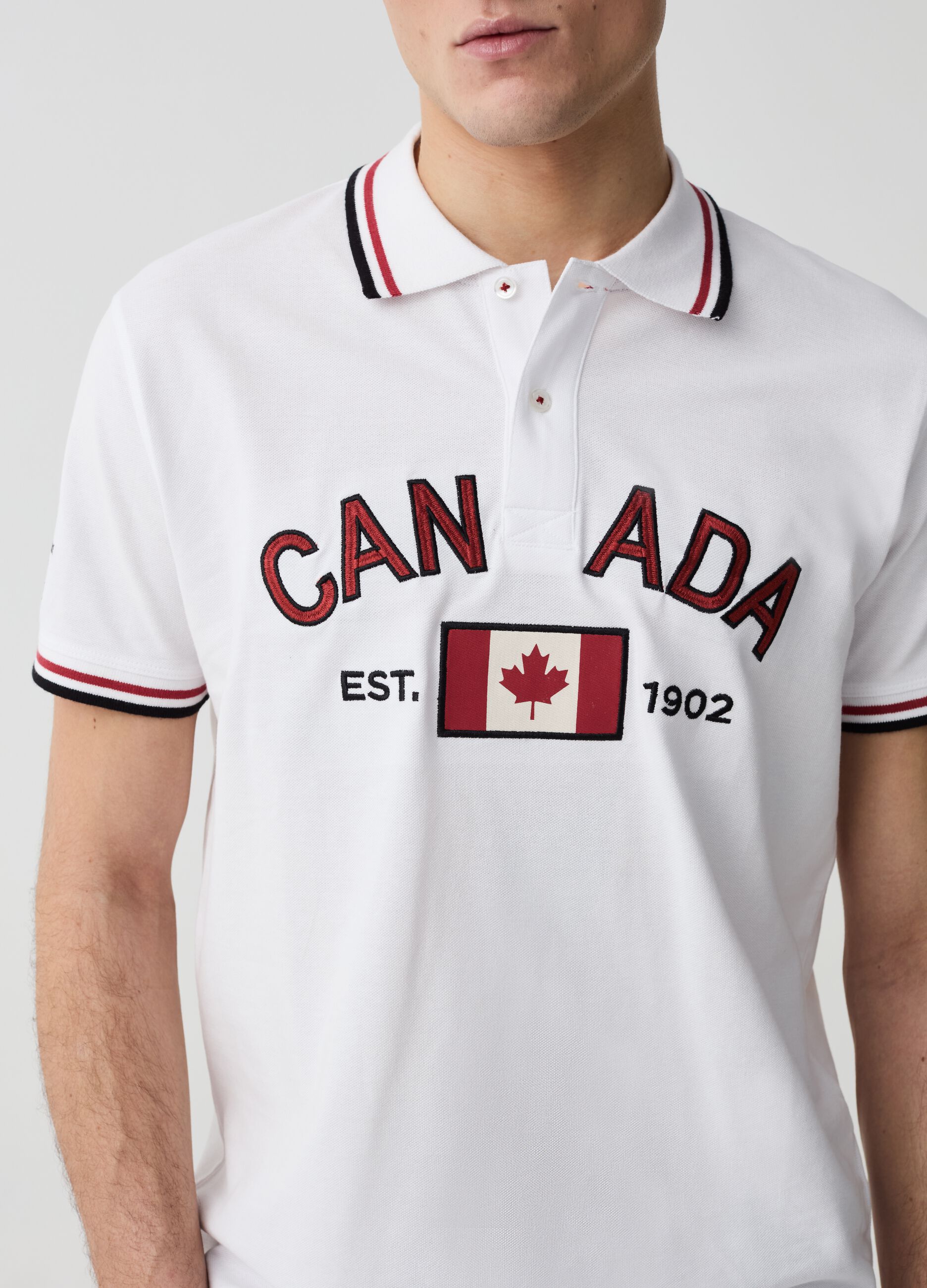Polo shirt with striped edging and Canada Trail embroidery