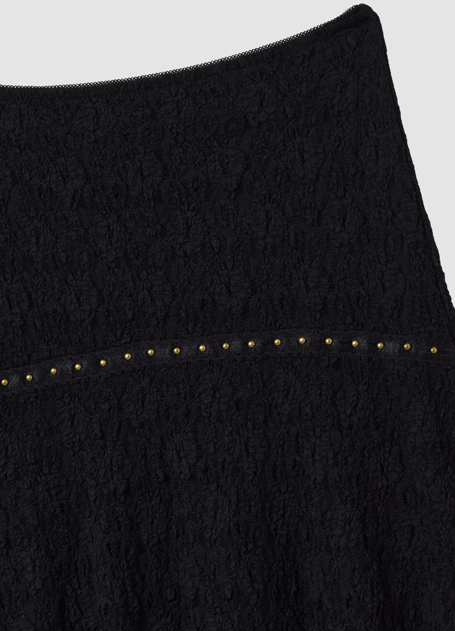 Black stretch skirt with asymmetric lace hem