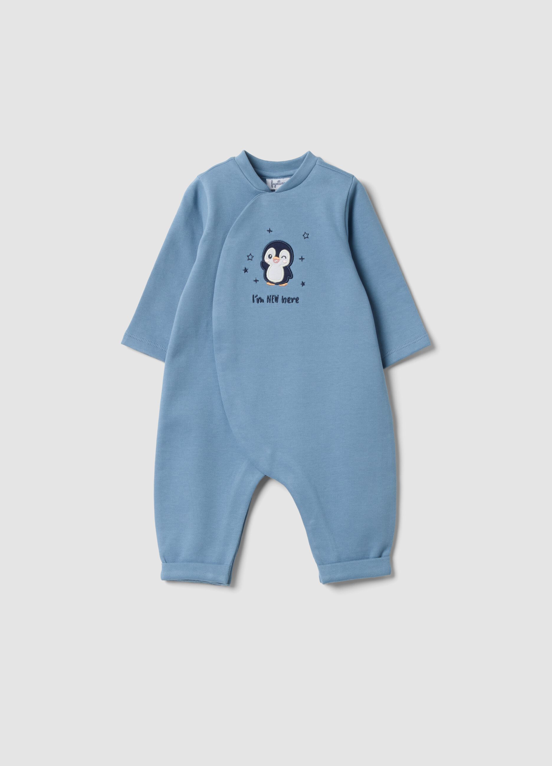 Tutina azzurra in puro cotone organico con ricamo