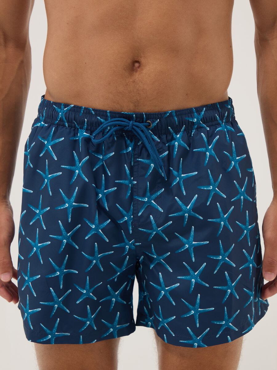 Blue boxer swim shorts with starfish print_1
