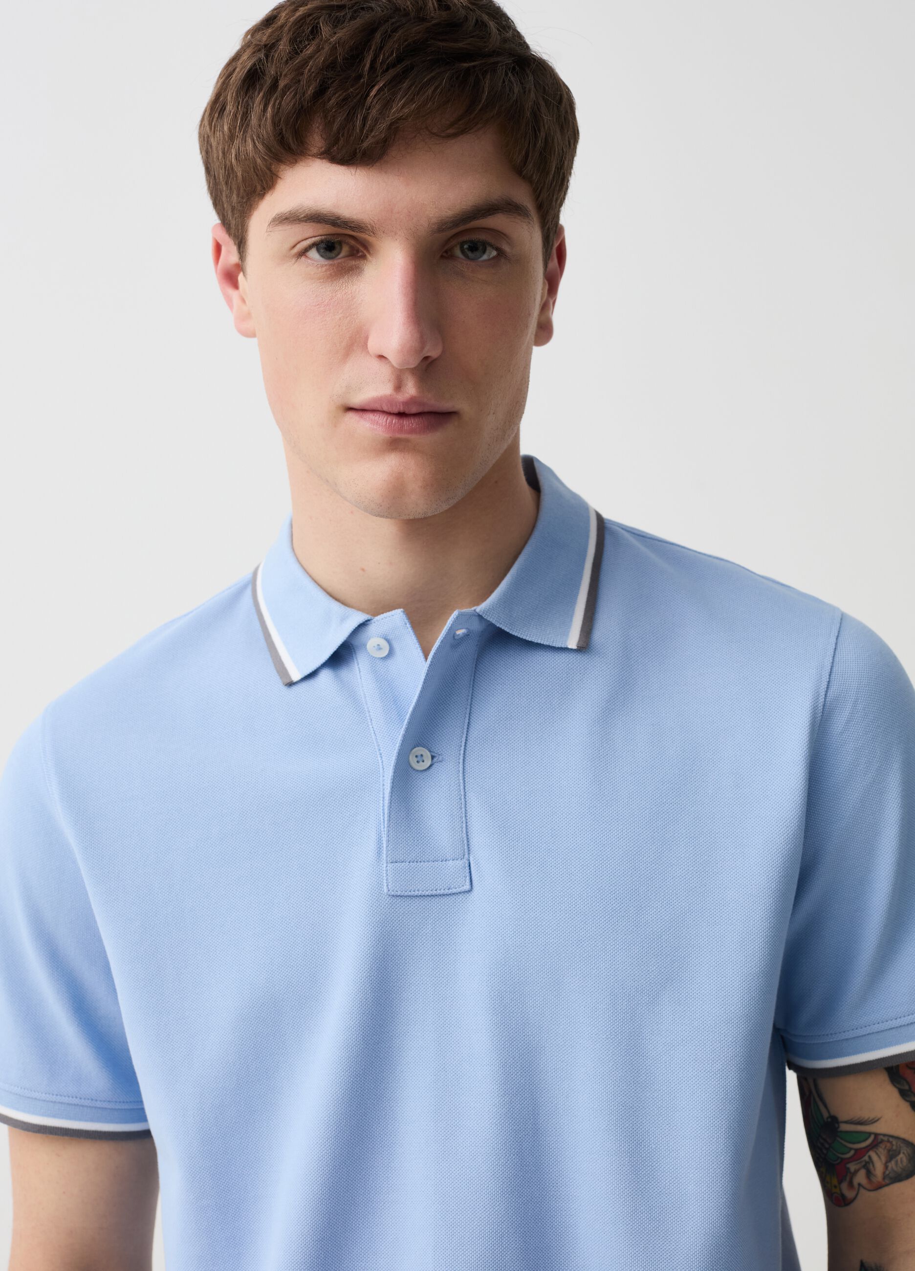 Polo shirt in piquet with striped edging