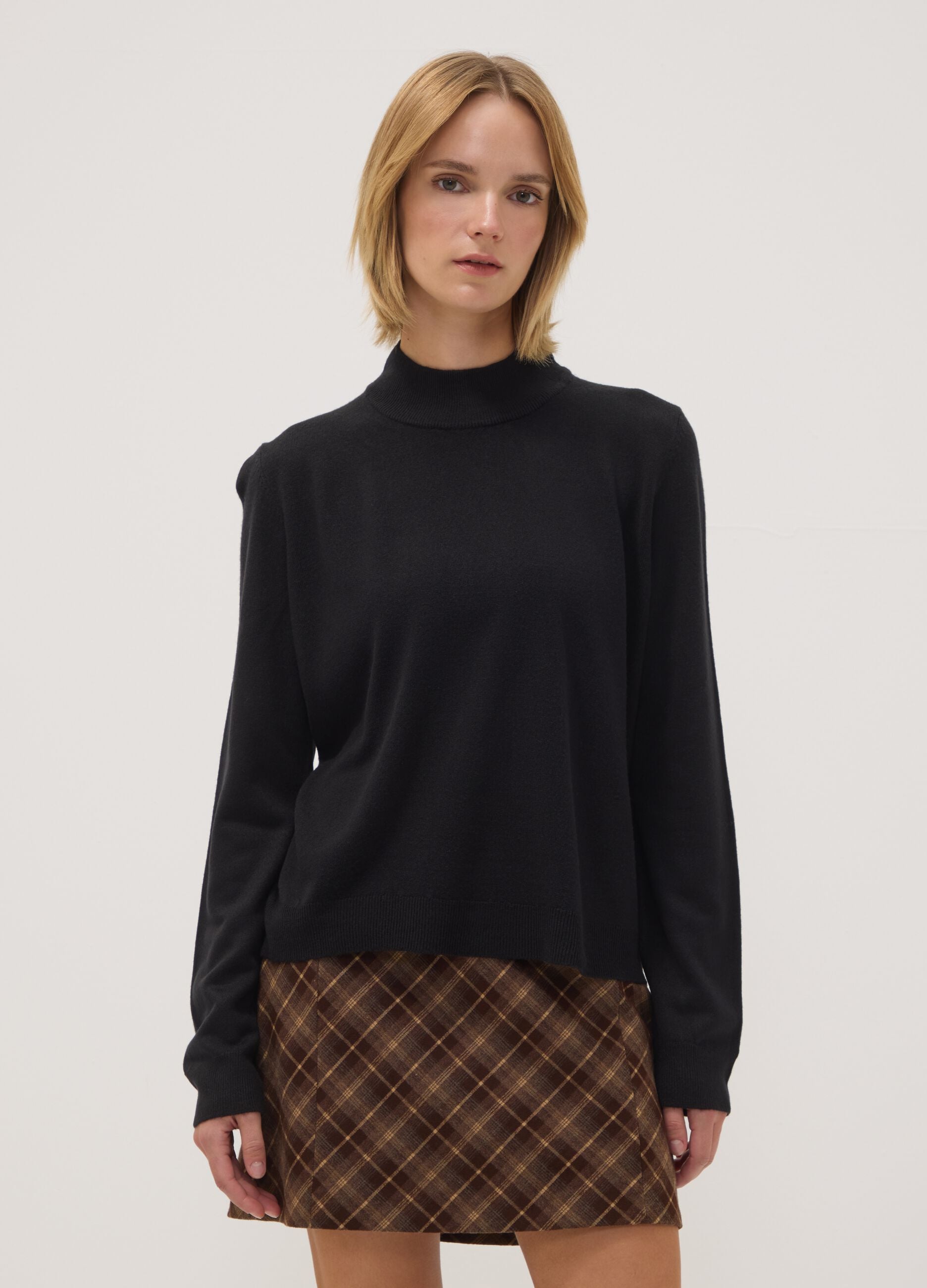 Black long-sleeve top with raised neckline, regular fit