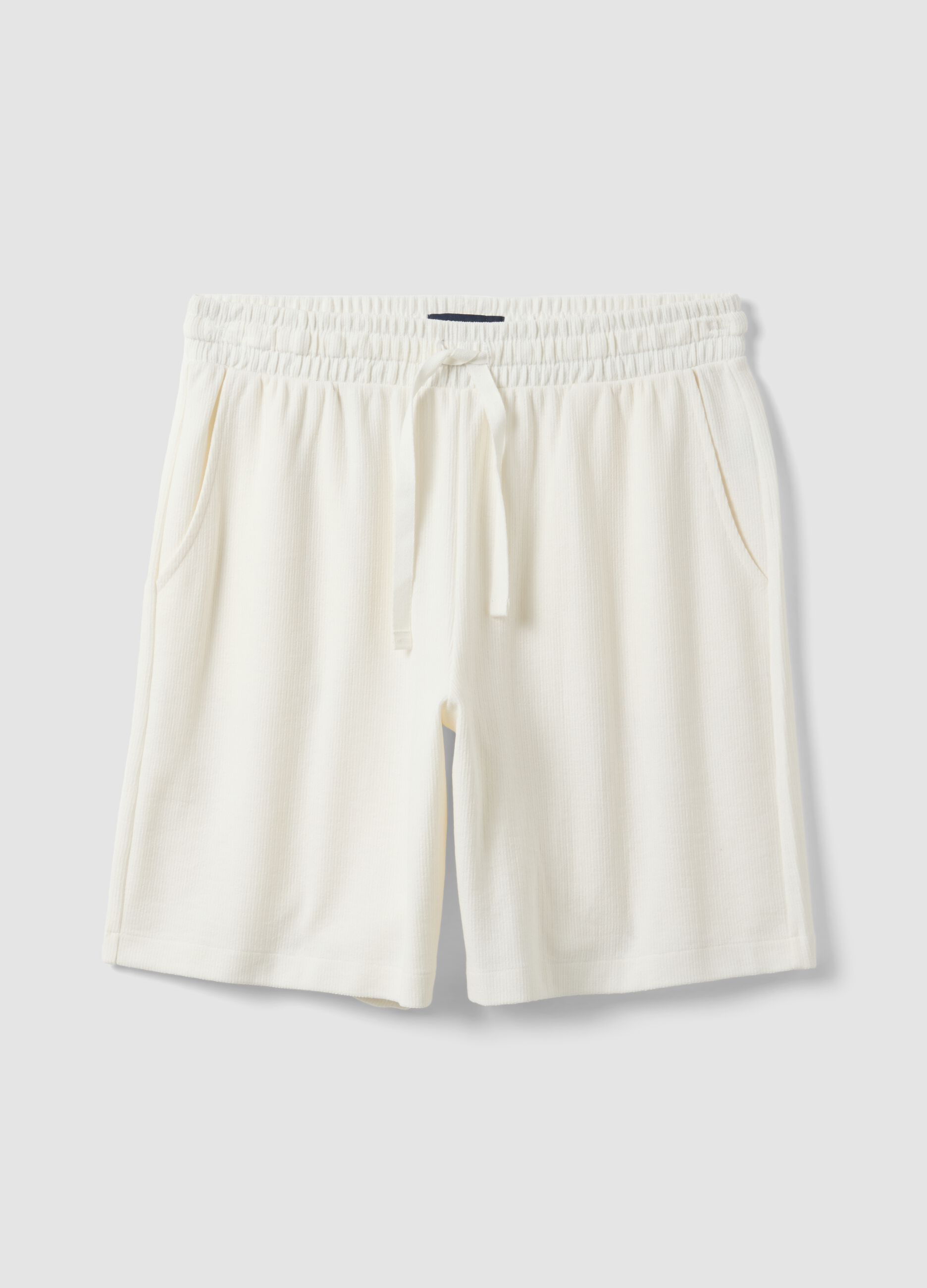 White cotton-blend jogger shorts with drawstring, relaxed fit