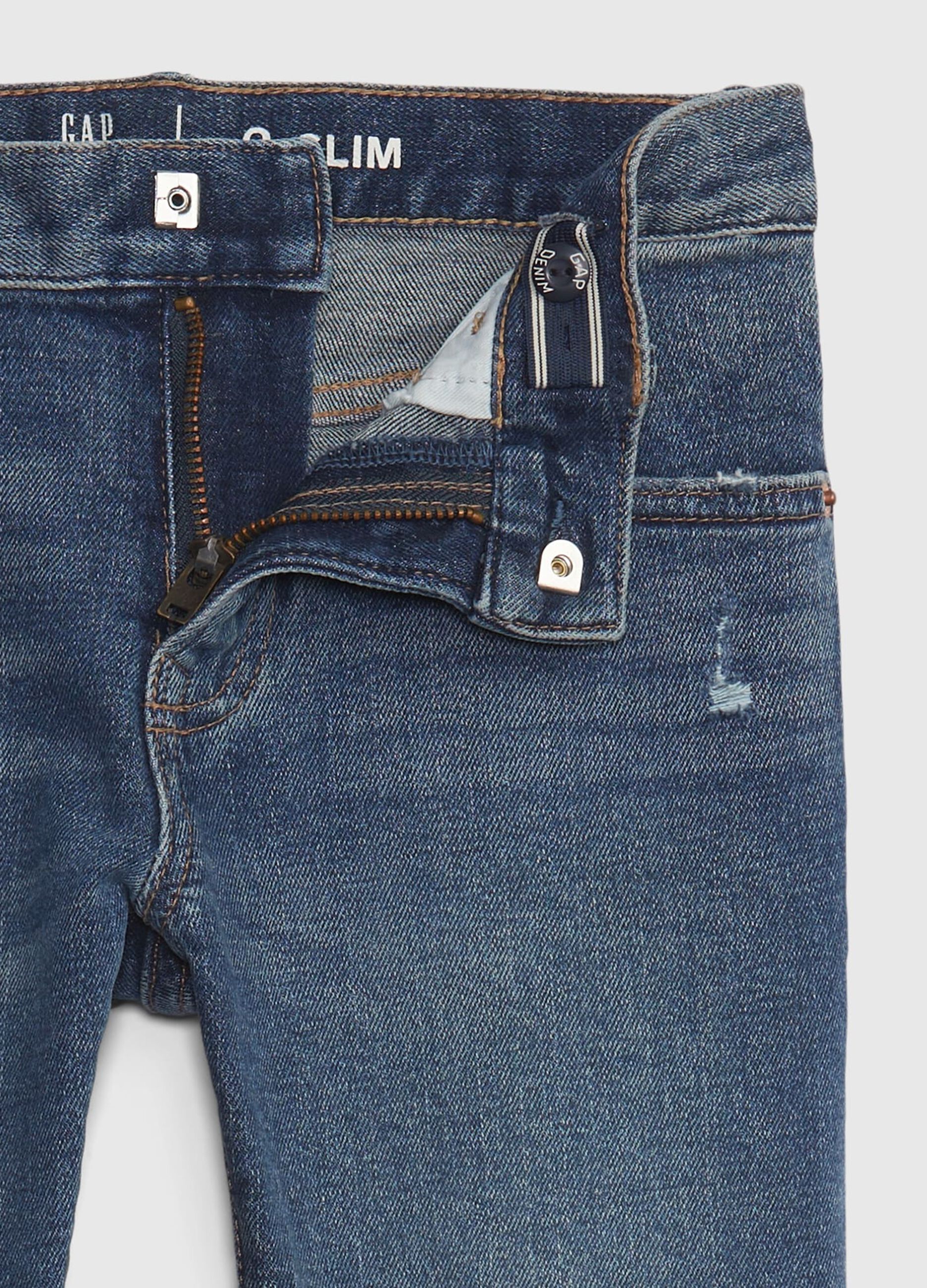 Slim-fit jeans with rips and fading