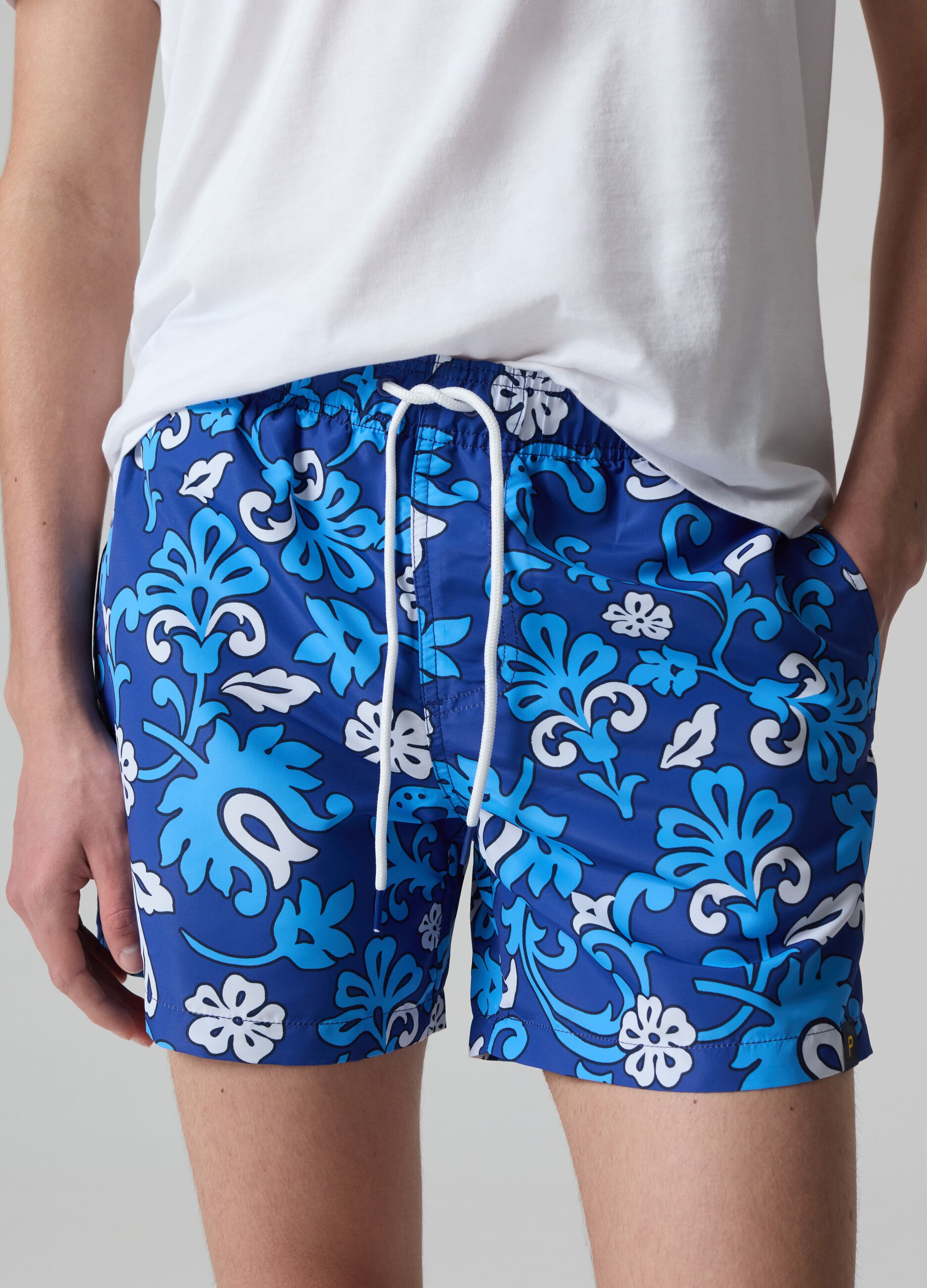 Bermuda swim shorts with floral print