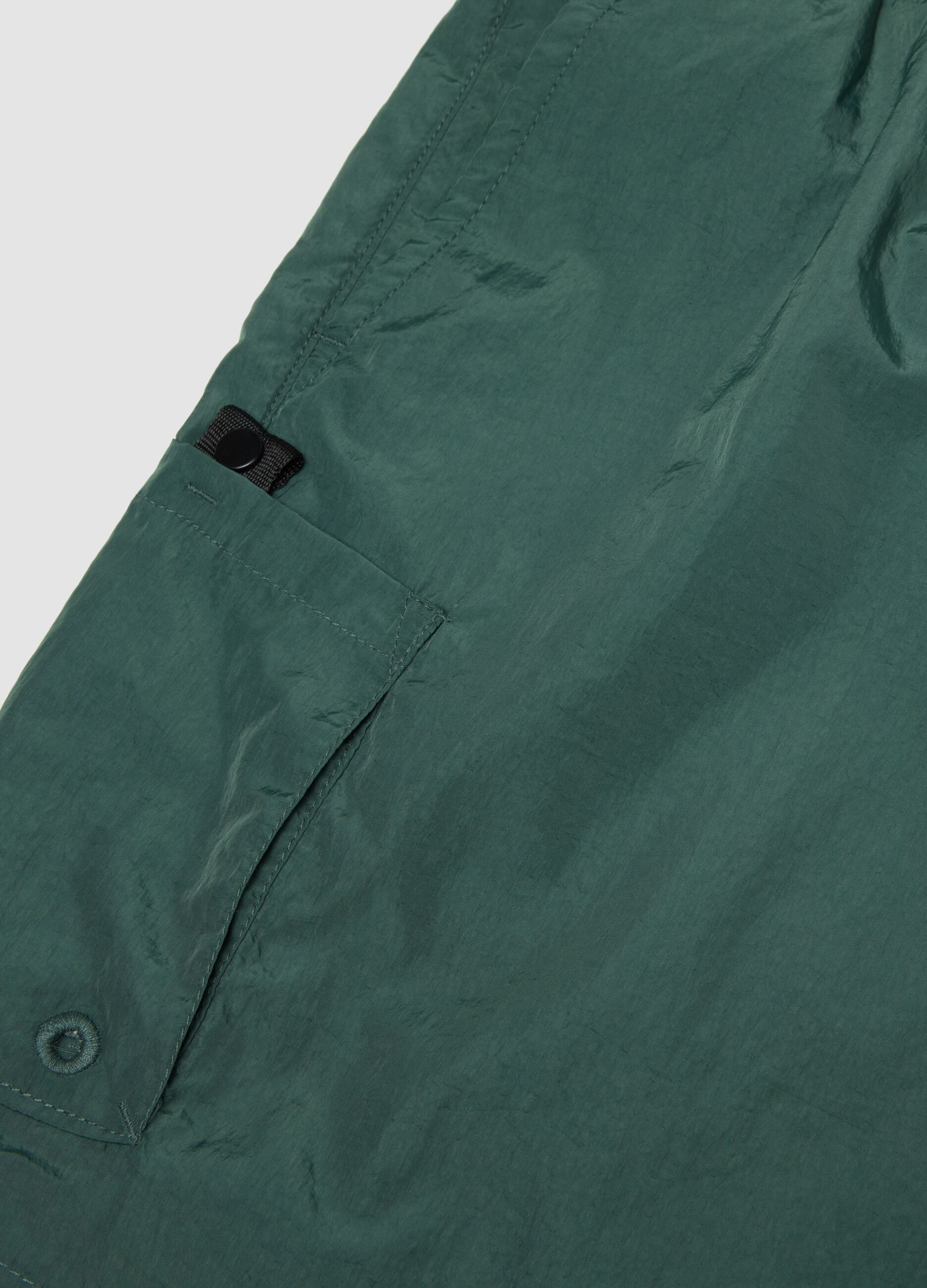 Green swim shorts with elasticated waistband