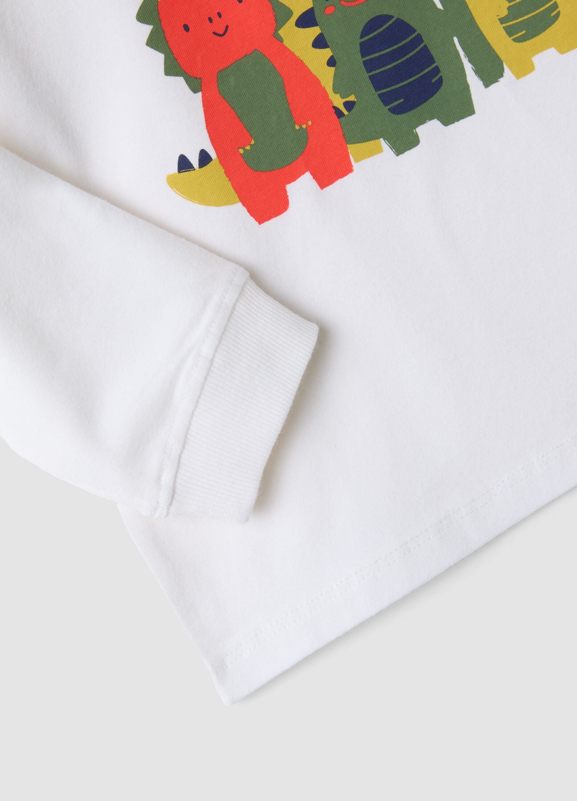 T-shirt bianca in cotone organico elasticizzato con dinosauri over fit