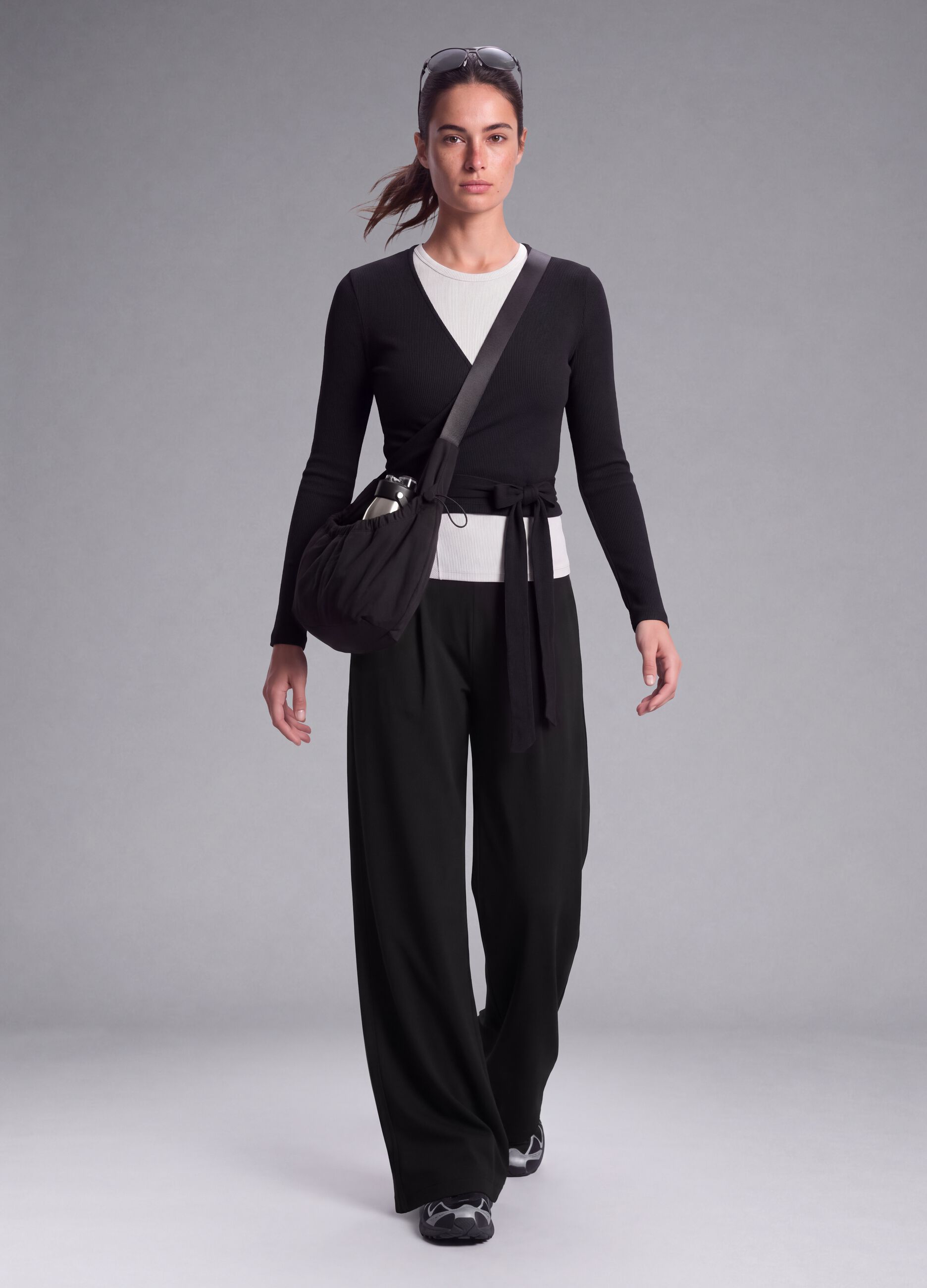 Black wide-leg stretch-fabric trousers