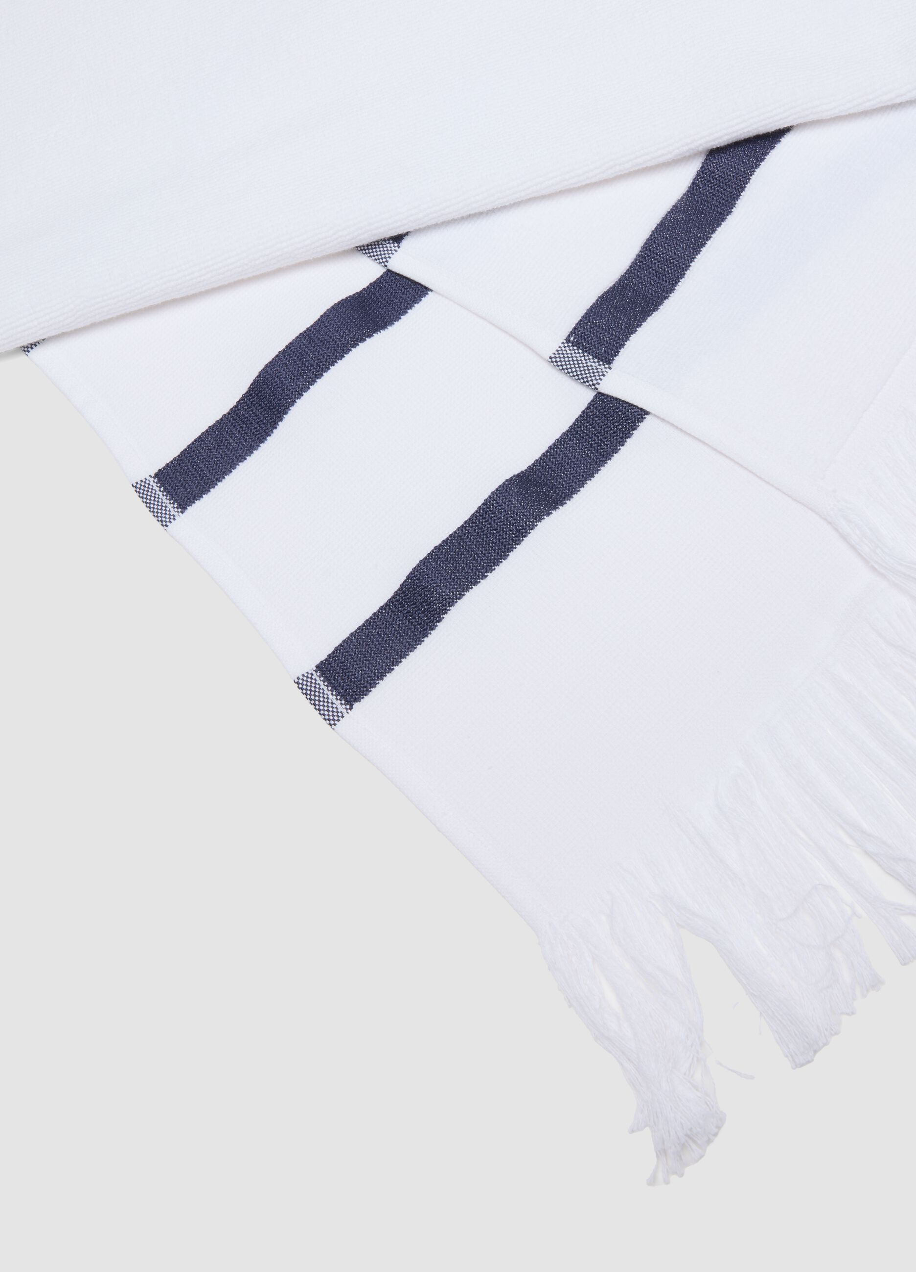 White cotton-blend beach towel with blue stripes