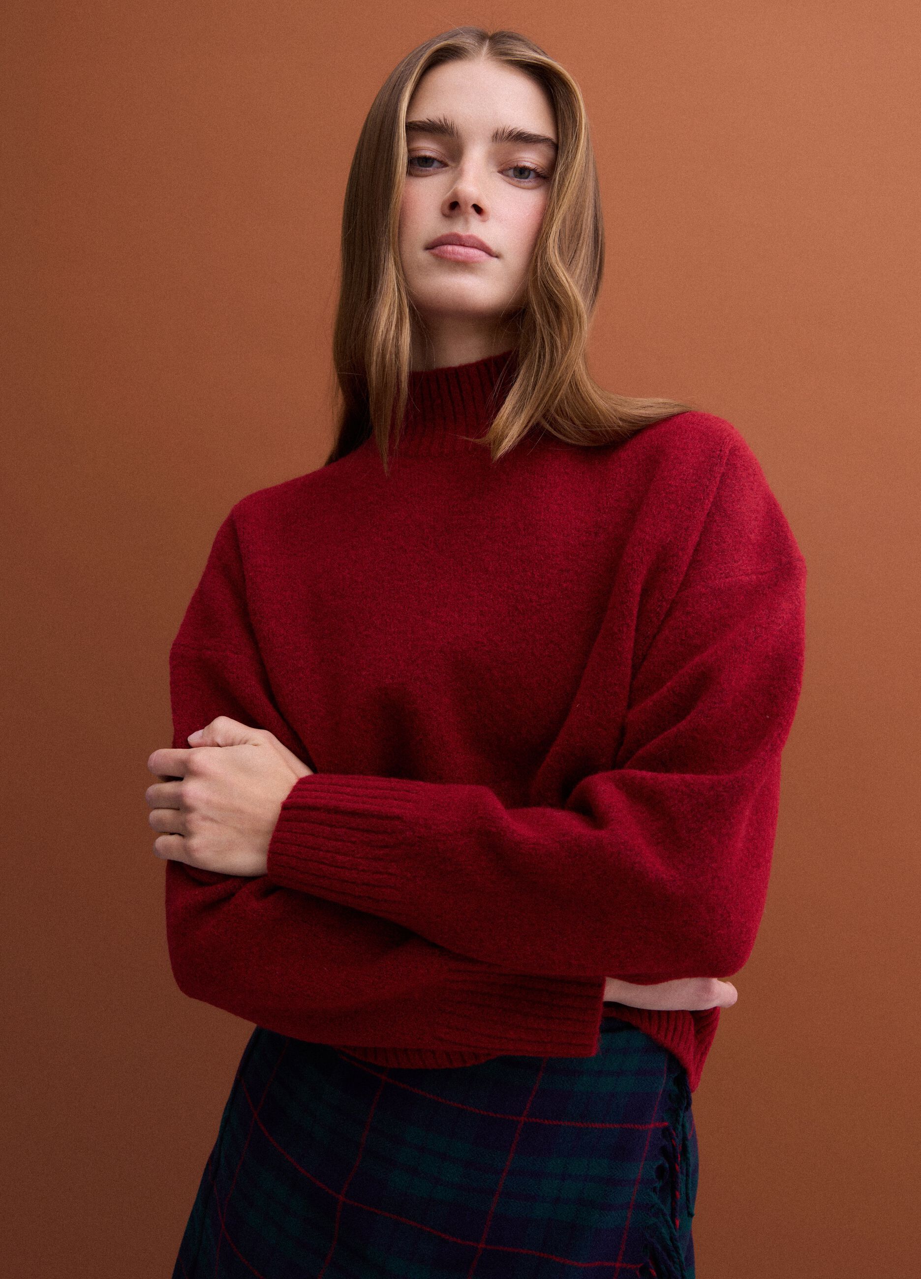 Red stretch wool jumper with raised neck