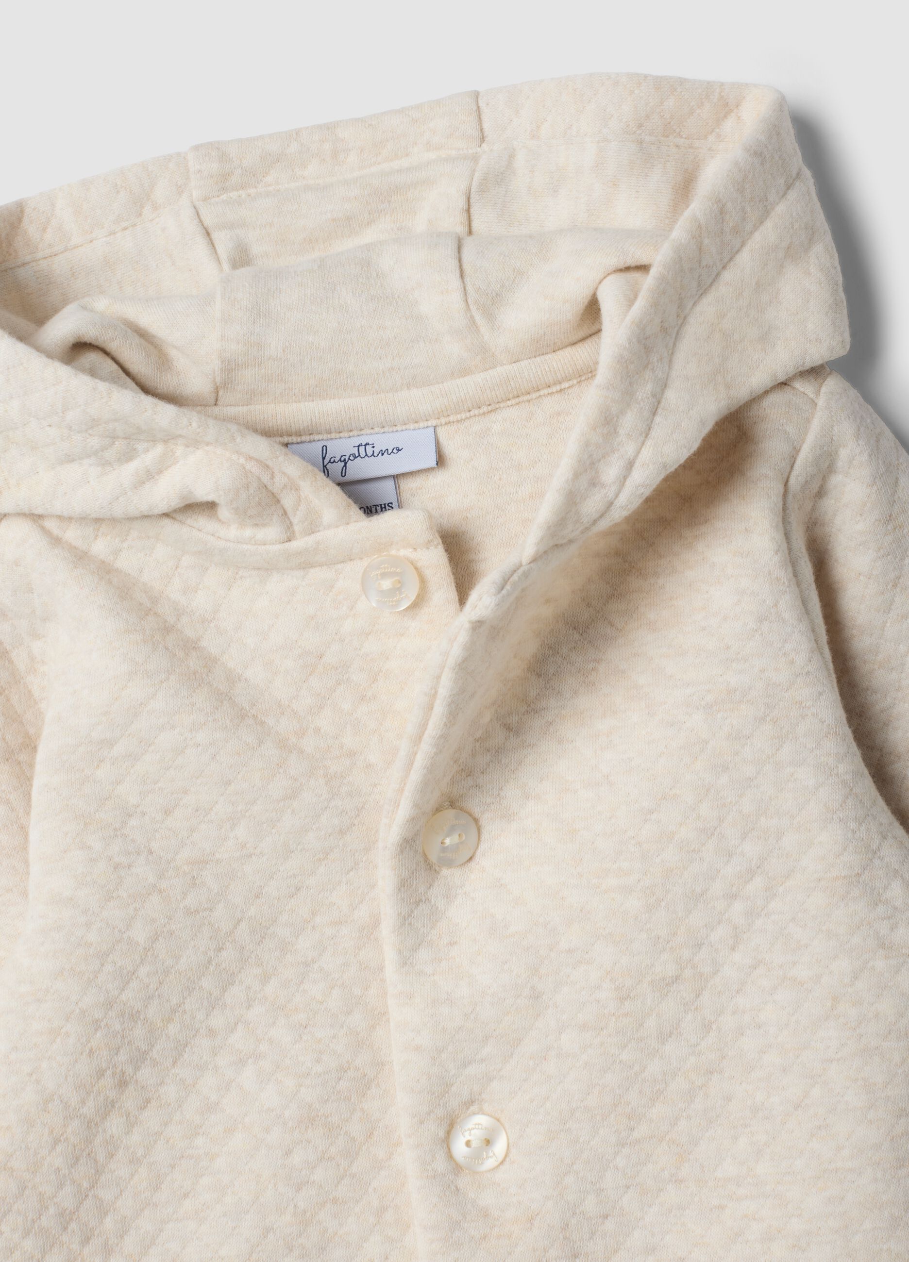 Beige hooded babygrow in organic cotton blend