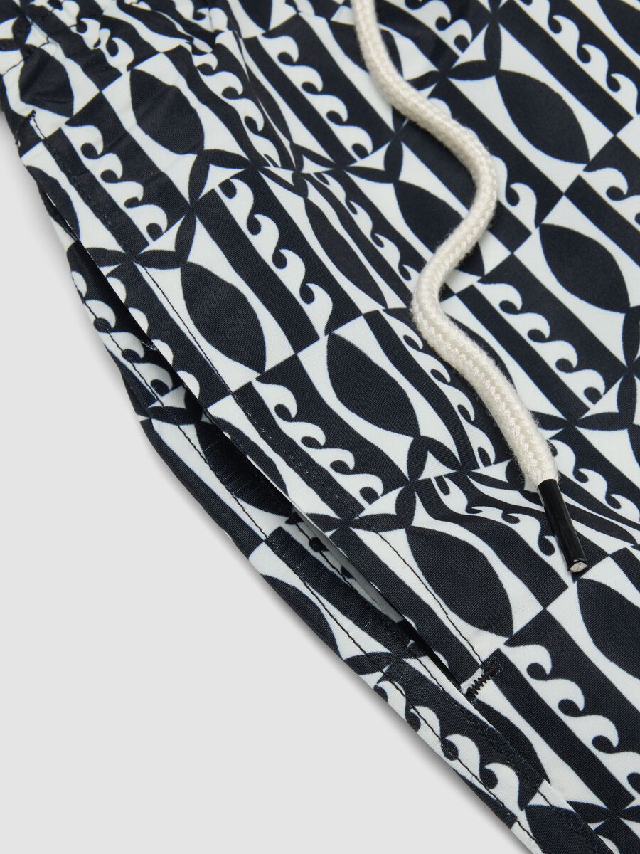 Blue swim shorts with graphic print_5