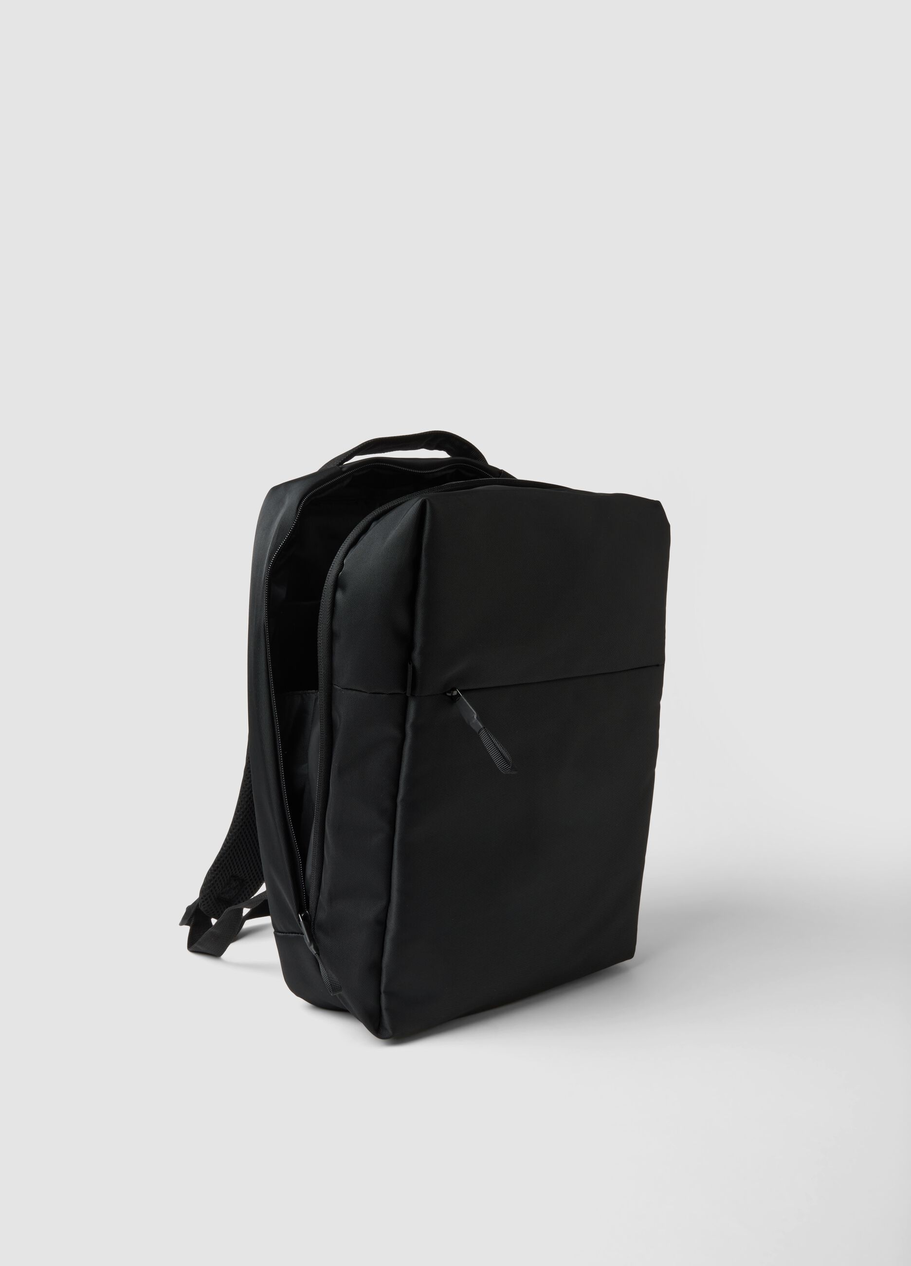 Black water-repellent backpack with front pocket and padded shoulder straps