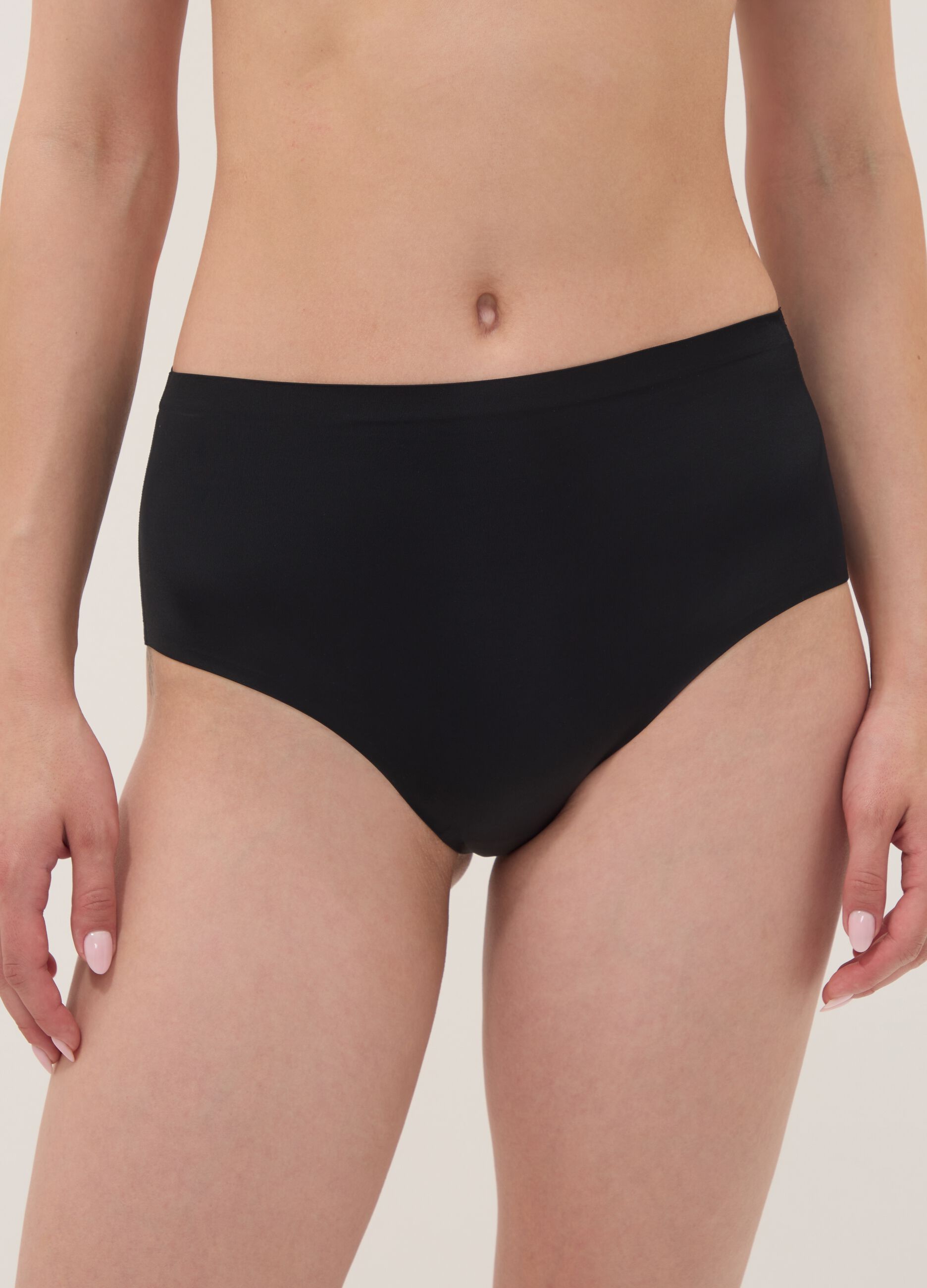 Black high-waisted Brazilian briefs in stretch fabric with a shaping effect