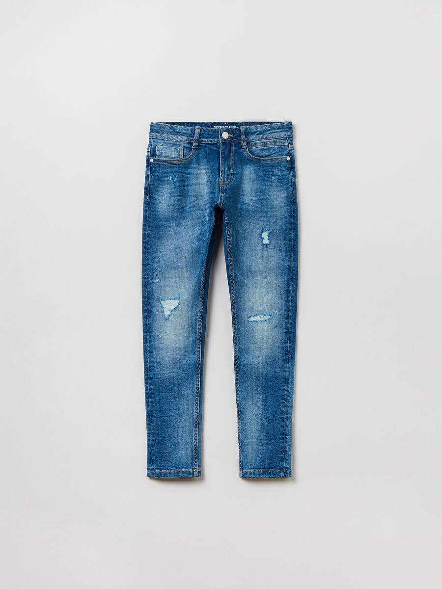 Slim-fit jeans with five pockets and abrasions_0