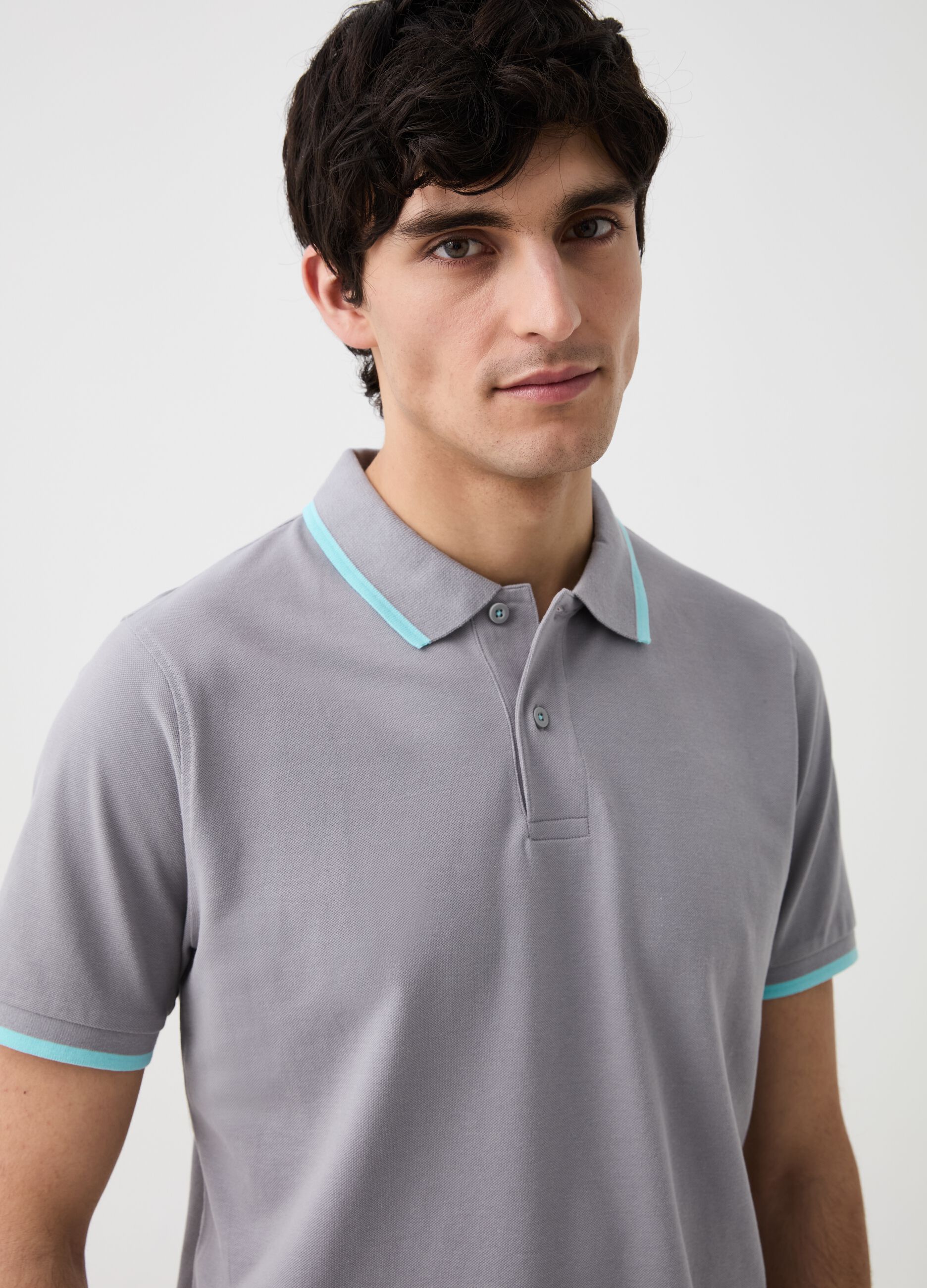 Solid colour polo shirt with fluorescent edging