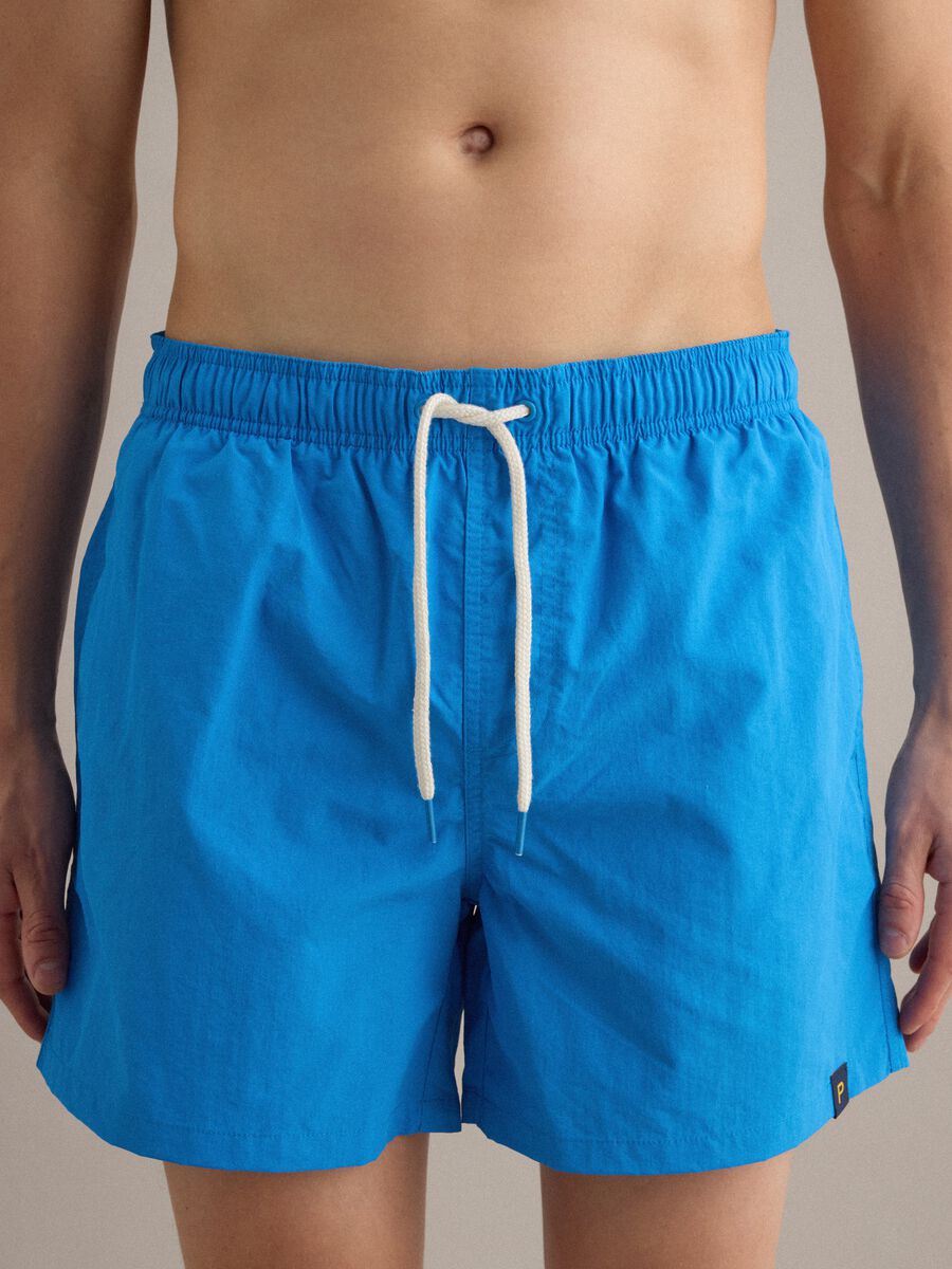 Blue swim shorts with elasticated waistband and contrast drawstring_2