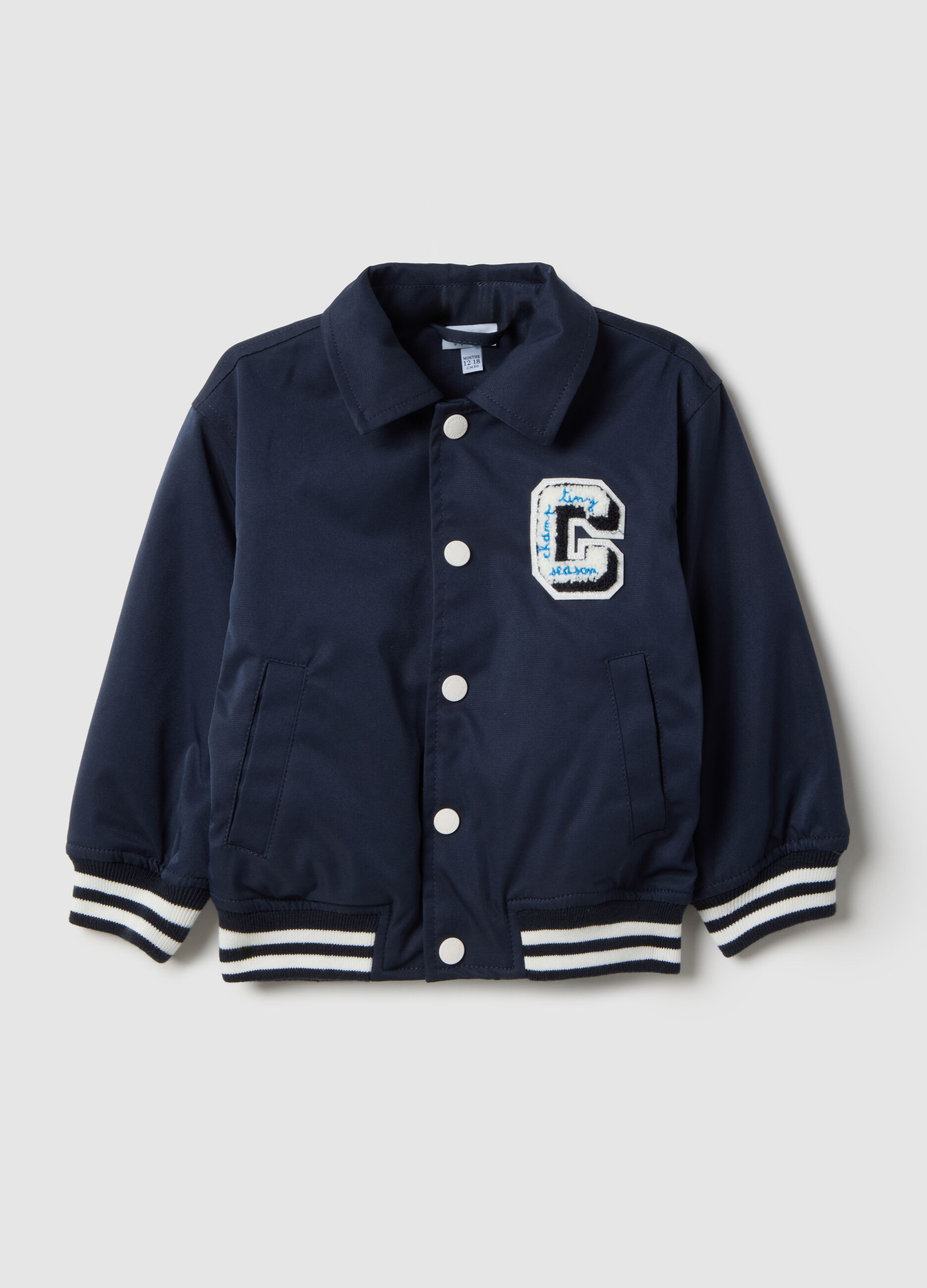 Regular fit blue jacket with striped cuffs for boys