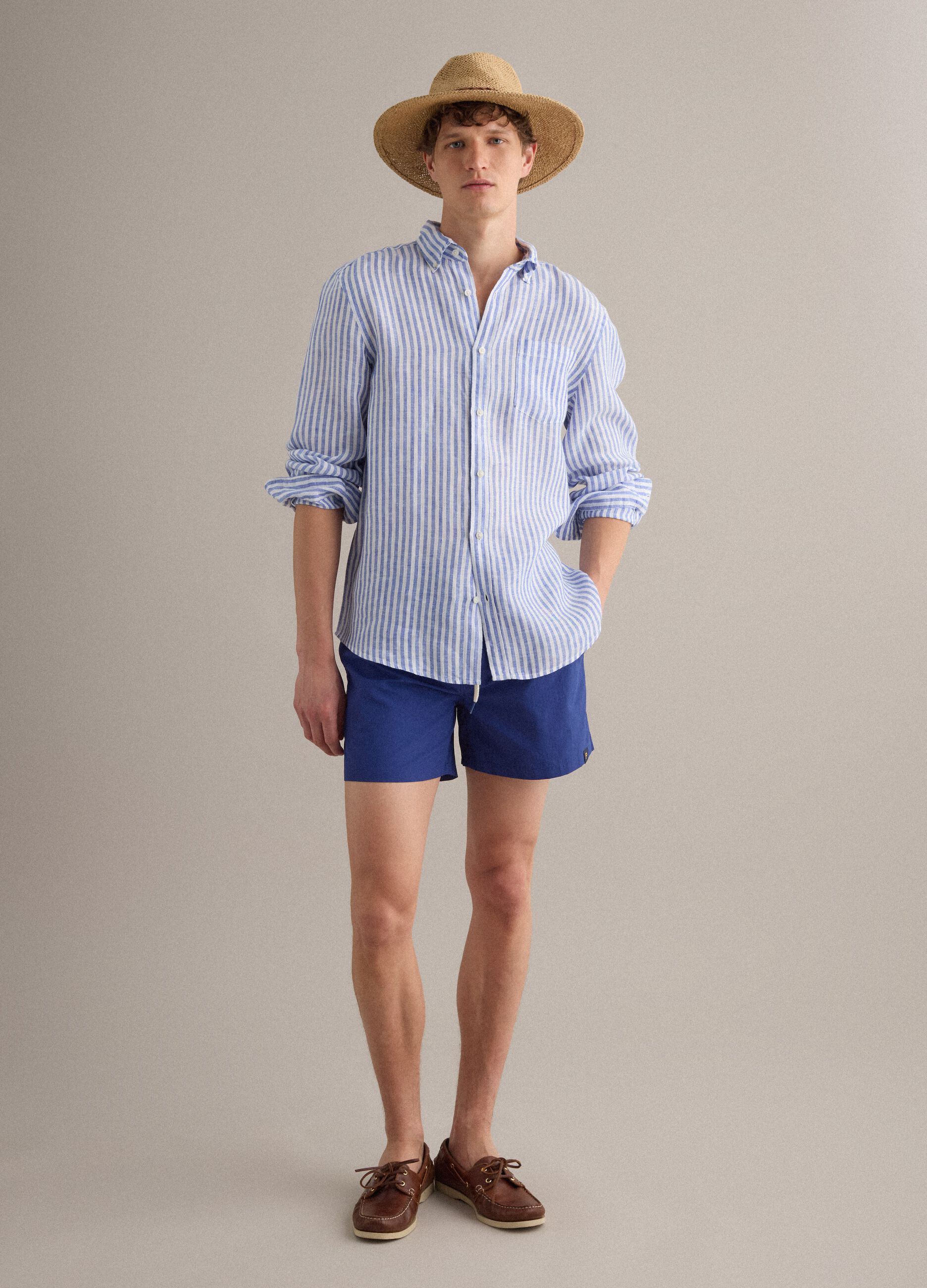 Blue swim shorts with elasticated waist and drawstring