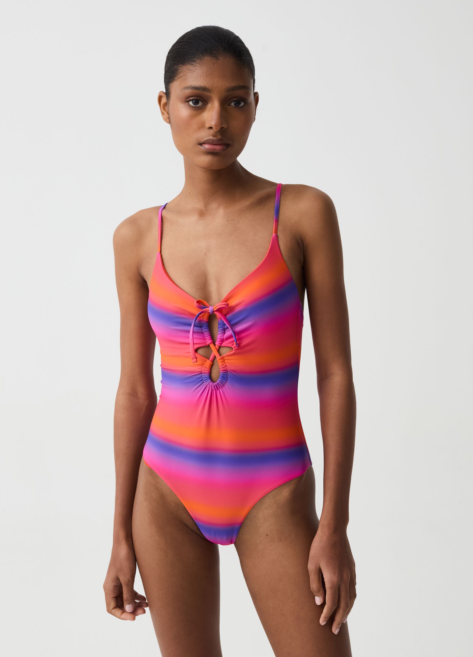 One-piece swimsuit with faded stripe pattern