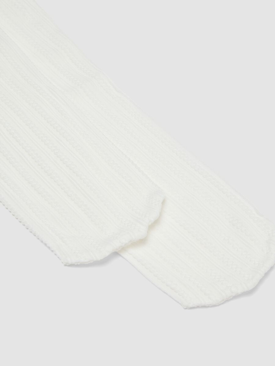 Collant bianco in tessuto elasticizzato con motivo lavorato_1