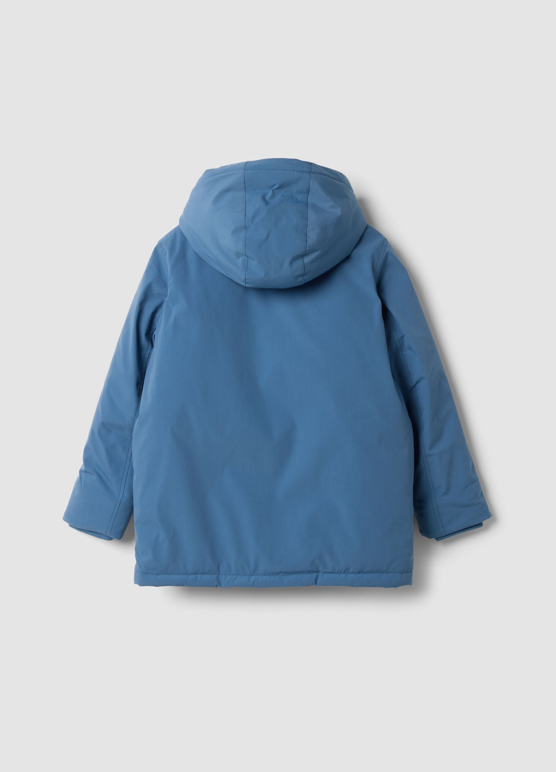 Long padded blue parka with detachable hood, oversized fit