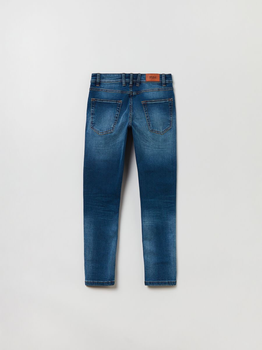 Slim-fit jeans with five pockets and abrasions_1