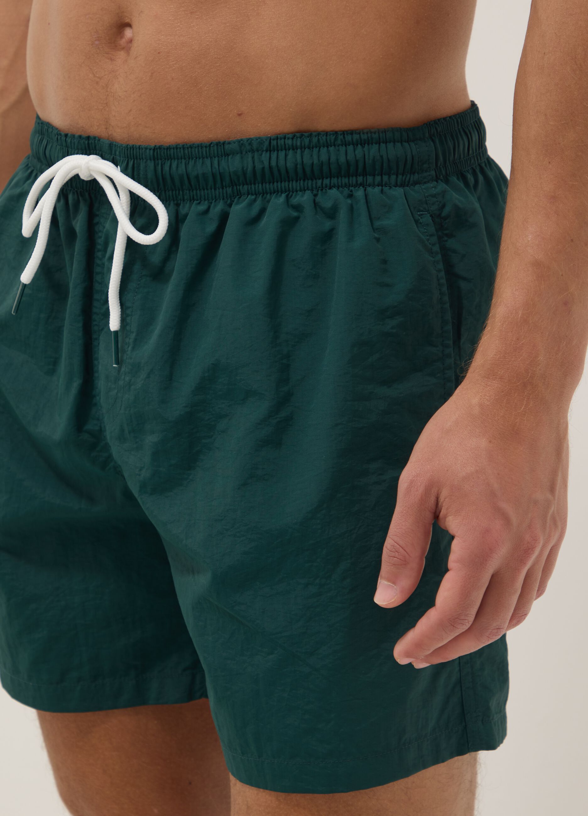 Green swim shorts with elasticated waistband