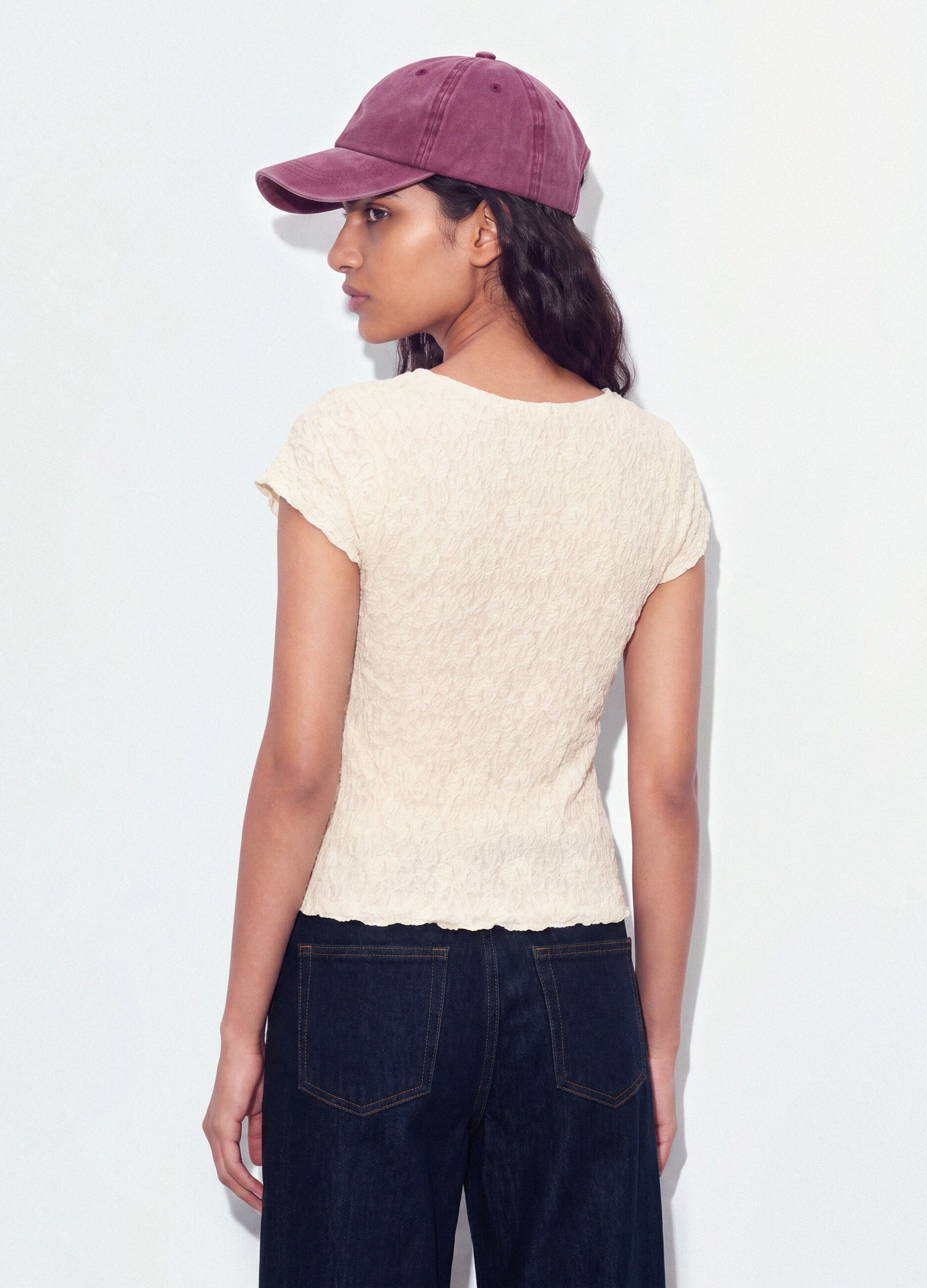 White stretch T-shirt with raised floral texture