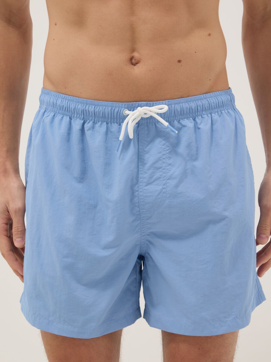 Blue swim shorts with elasticated waist_1