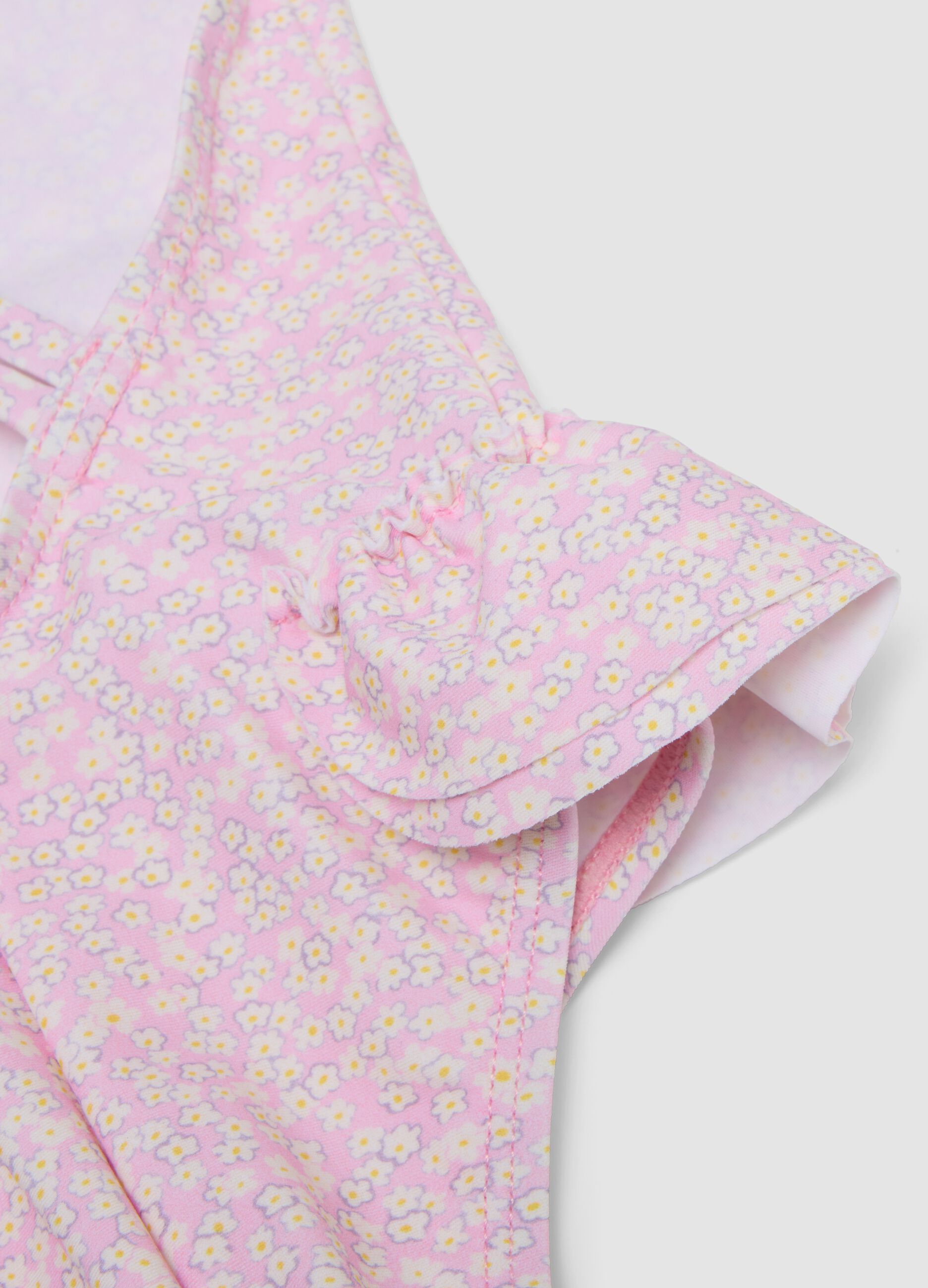 Pink stretch swimsuit with appliqu&eacute; flowers