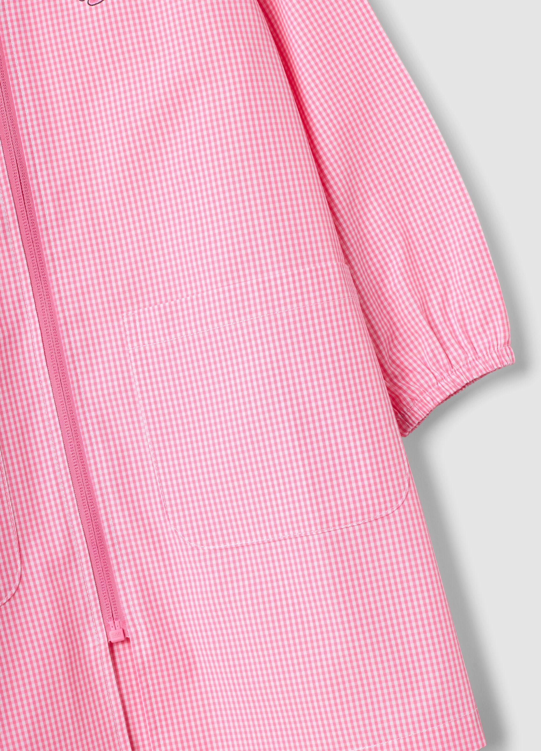 Pink gingham nursery apron with white collar and Minnie embroidery