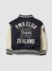 Blue varsity jacket with beige sleeves and print for boys_2