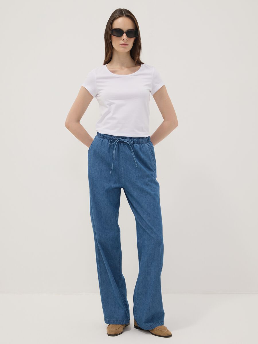 Pantaloni denim blu in puro cotone wide leg con coulisse_0