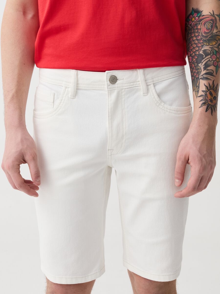 Slim-fit Bermuda shorts in solid colour denim_1
