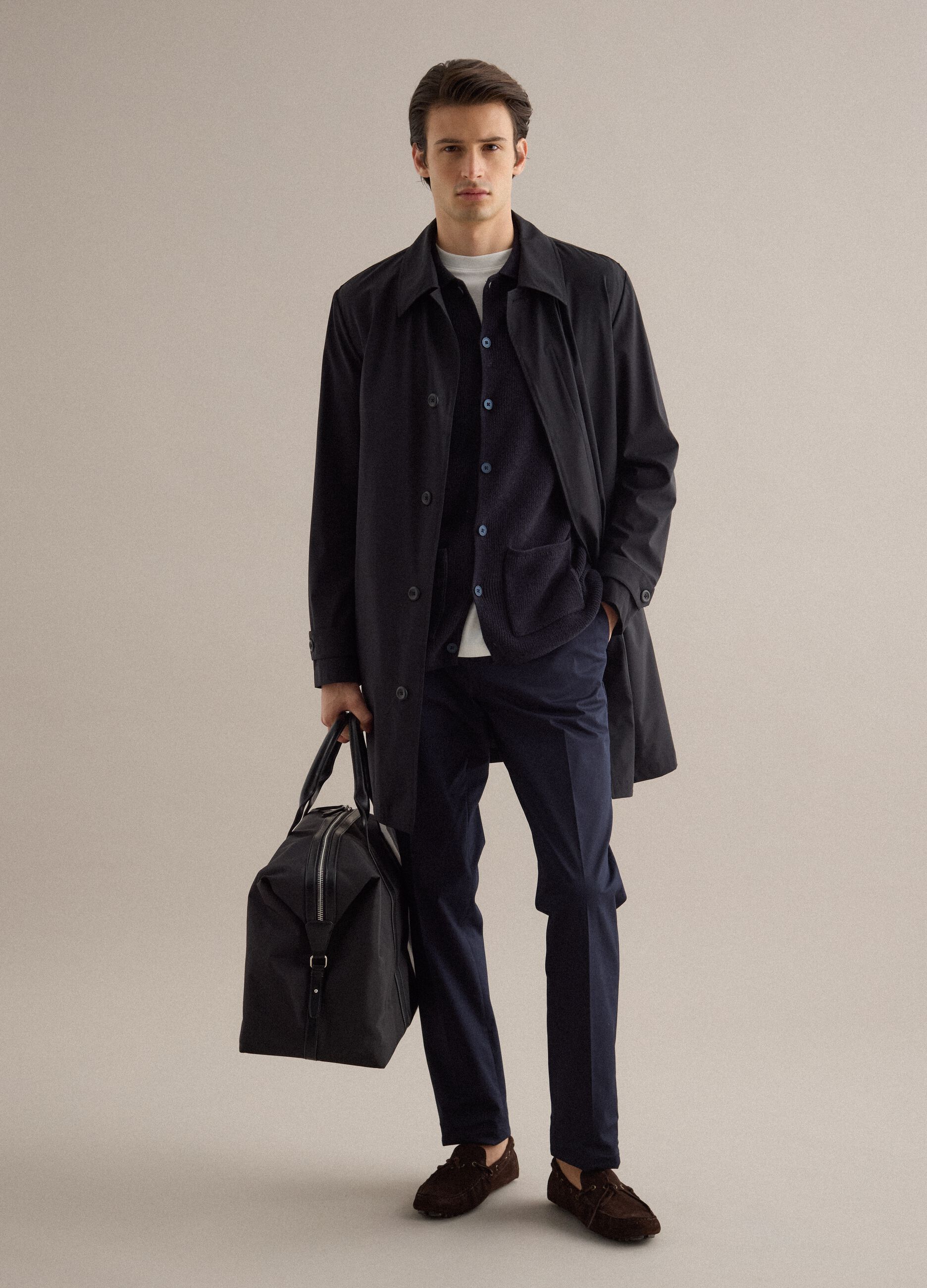 Black travel bag with strong handles and zip closure