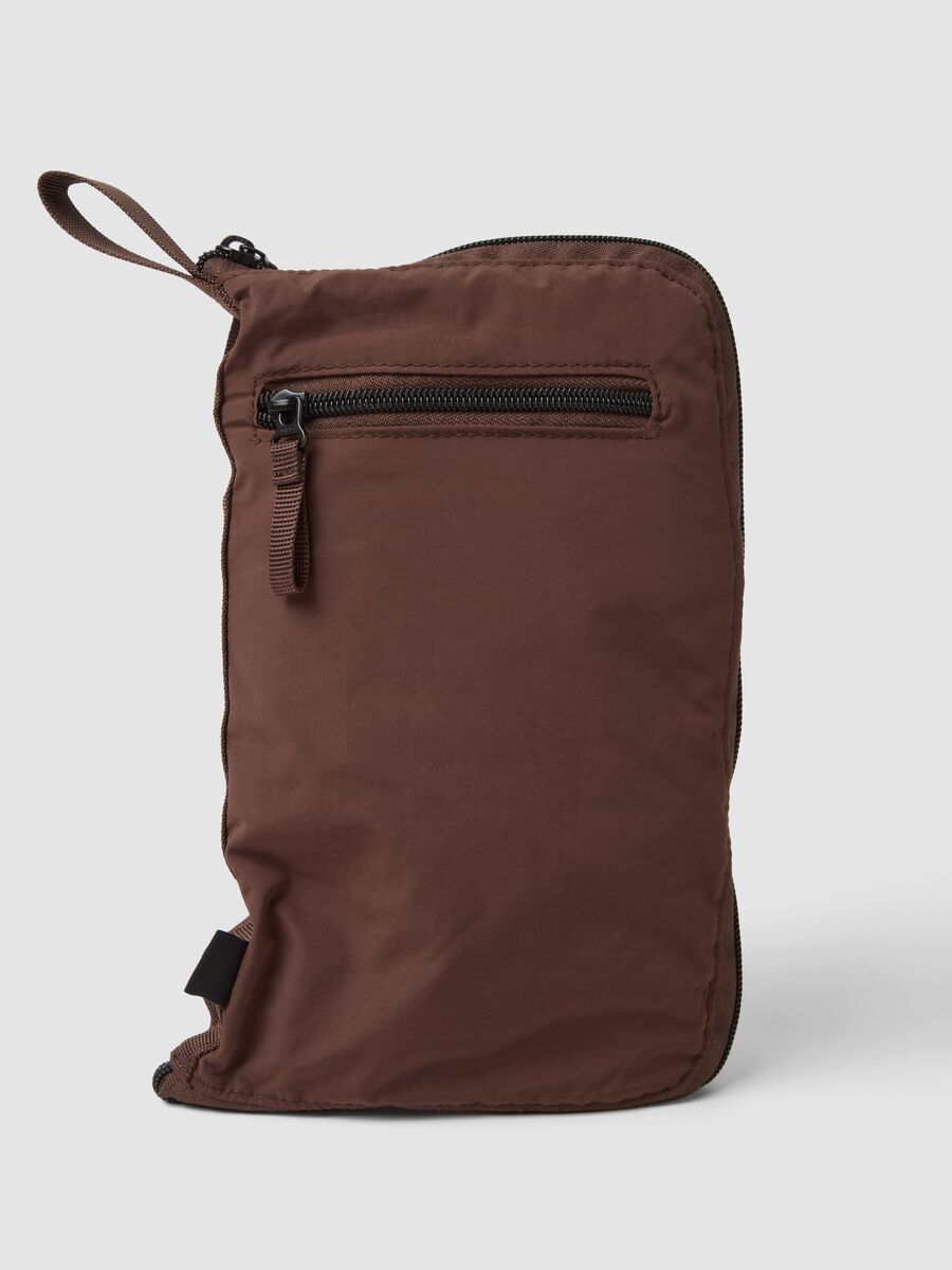 Brown foldable travel bag with shoulder strap and zip pockets_2