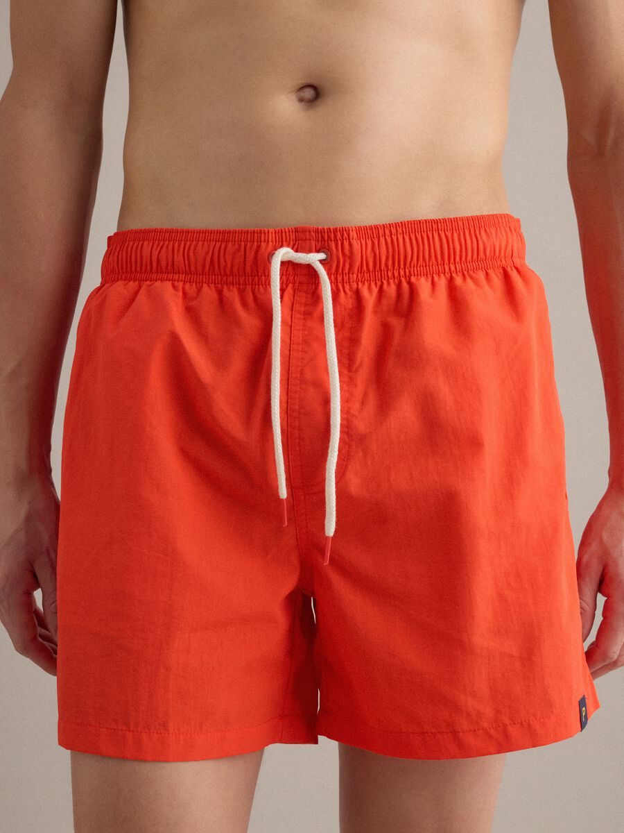 Orange swim shorts with elasticated waistband and drawstring_2